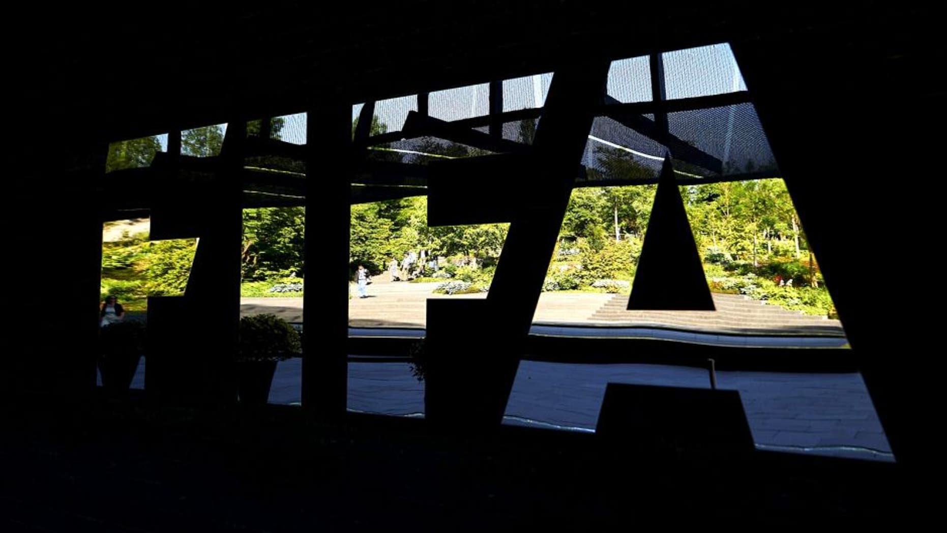 The FIFA logo made with mirrors is pictured at the FIFA headquarters on June 3, 2015 in Zurich. Blatter on June 2, 2015 resigned as president of FIFA as a mounting corruption scandal engulfed world football's governing body. The 79-year-old Swiss official, FIFA president for 17 years and only reelected on May 29, said a special congress would be called as soon as possible to elect a successor. AFP PHOTO / MICHAEL BUHOLZER (Photo credit should read MICHAEL BUHOLZER/AFP/Getty Images)
