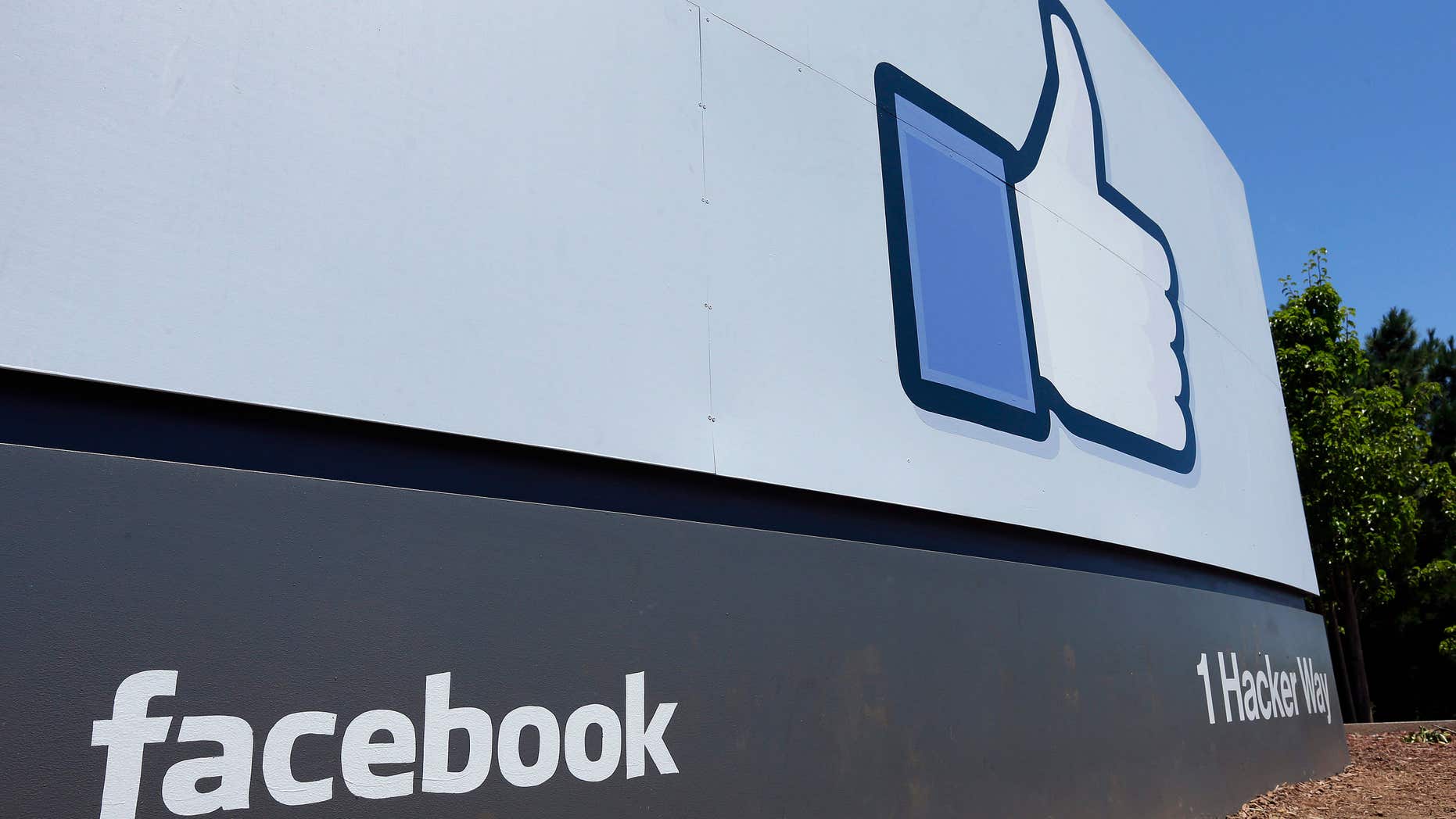 FILE - This July 16, 2013 file photo shows a sign at Facebook headquarters in Menlo Park, Calif. The heartache of a broken relationship may soon become less painful on Facebook.