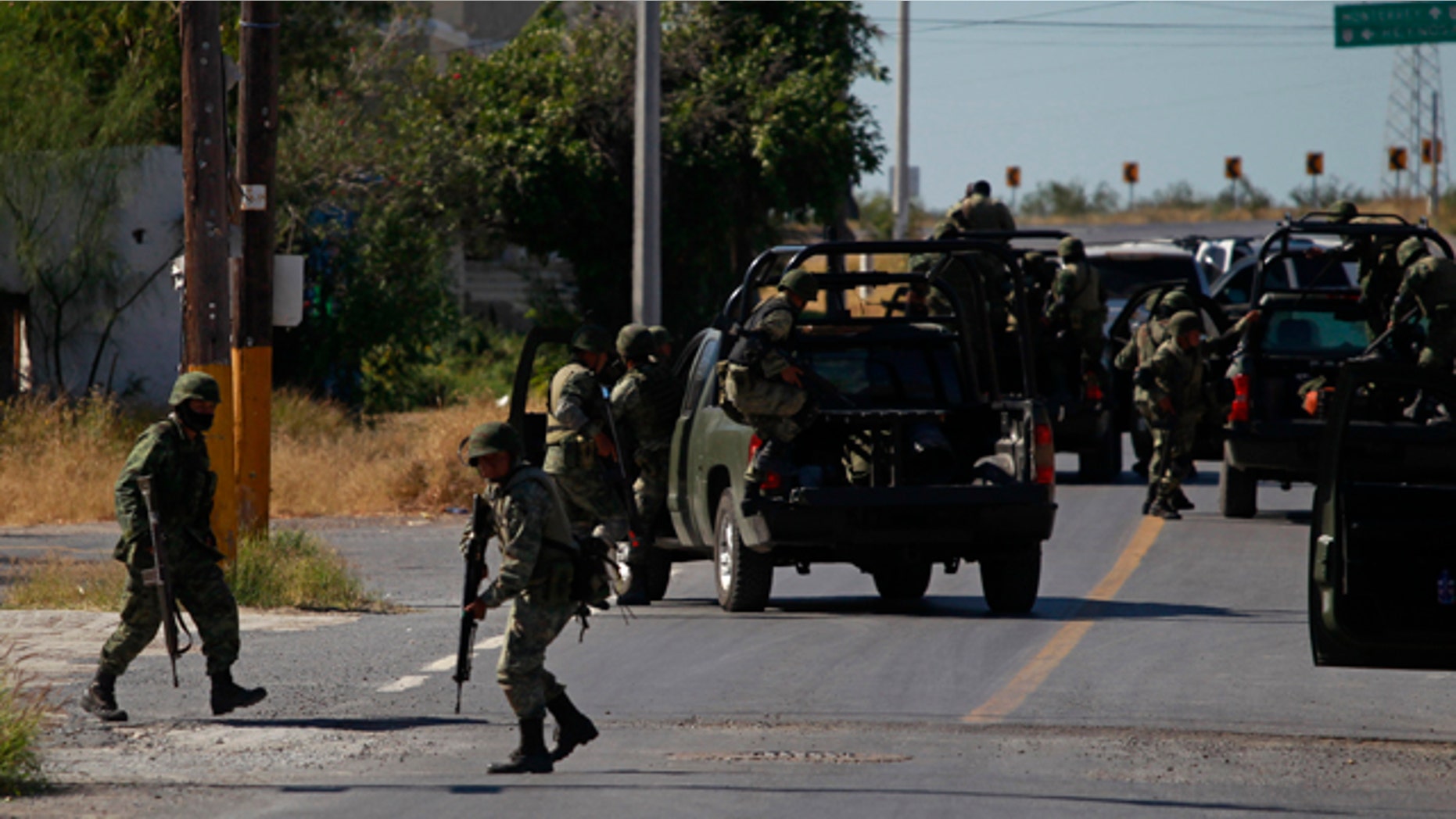 Nov. 19: Soldiers prepare to leave after inspecting a house in Ciudad Mier, Mexico.