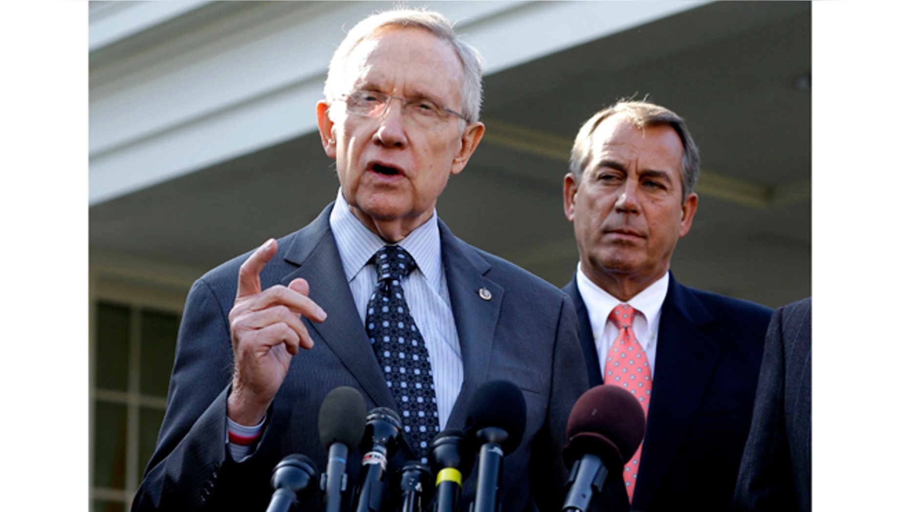 Nov. 16, 2012: Senate Majority Leader Harry Reid of Nev., left, with House Speaker John Boehner of Ohio looking on, speaking to reporters outside the White House in Washington following a meeting with President Barack Obama to discuss the economy and the deficit.