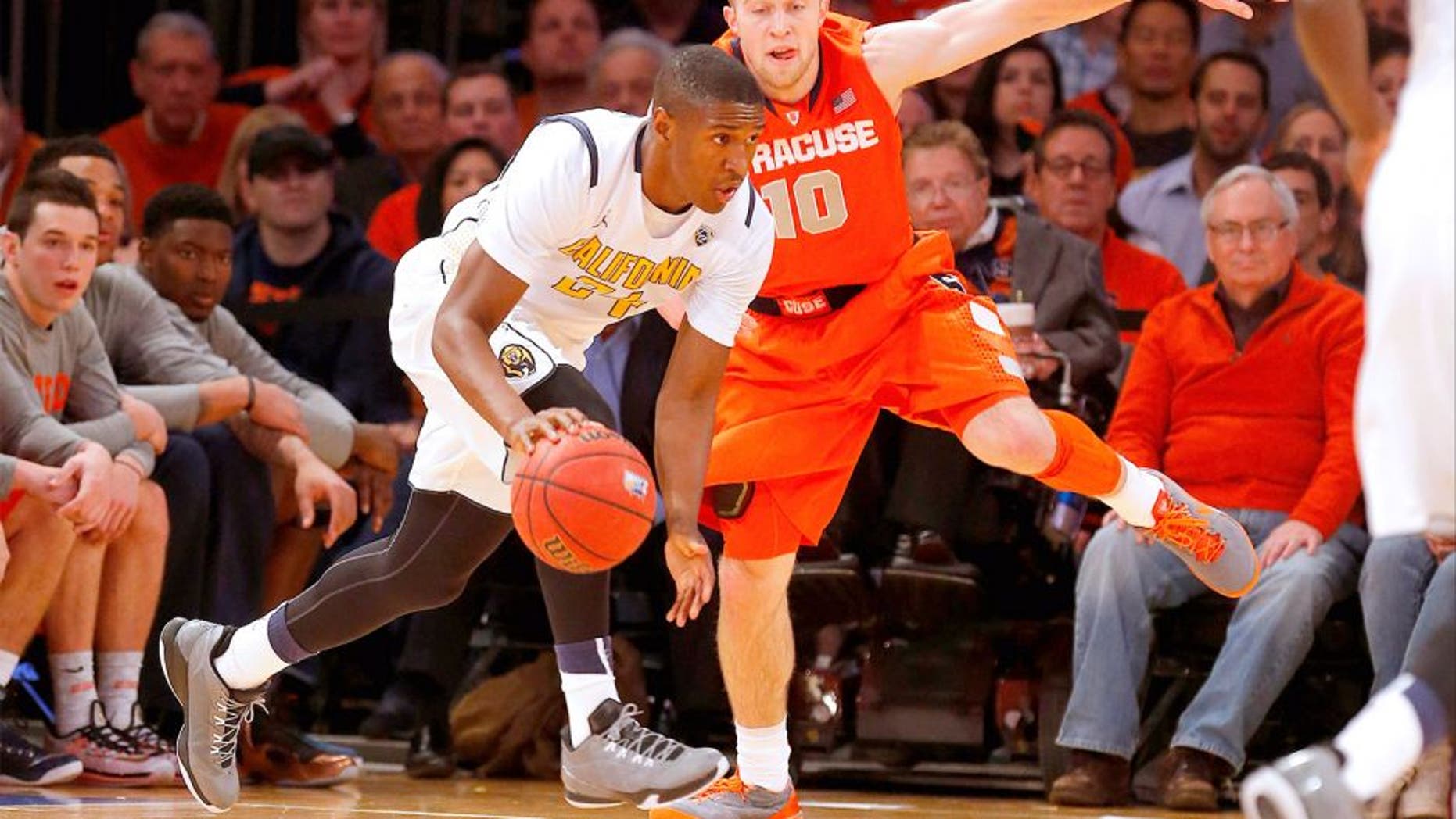 Nov 20, 2014; New York, NY, USA; California Golden Bears guard Jordan Mathews (24) works against Syracuse Orange guard Trevor Cooney (10) during the first half at Madison Square Garden. Mandatory Credit: Jim O'Connor-USA TODAY Sports
