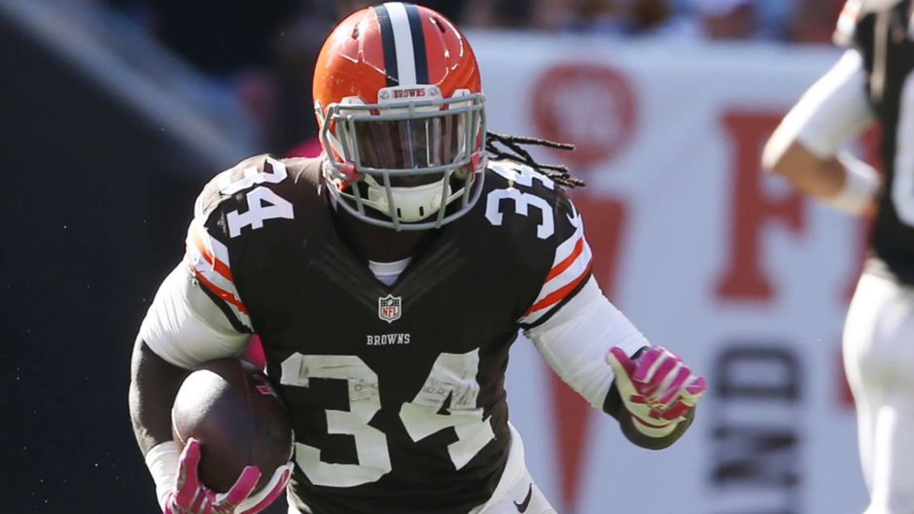 Oct 12, 2014; Cleveland, OH, USA; Cleveland Browns running back Isaiah Crowell (34) against the Pittsburgh Steelers during the fourth quarter at FirstEnergy Stadium. The Browns won 31-10. Mandatory Credit: Ron Schwane-USA TODAY Sports