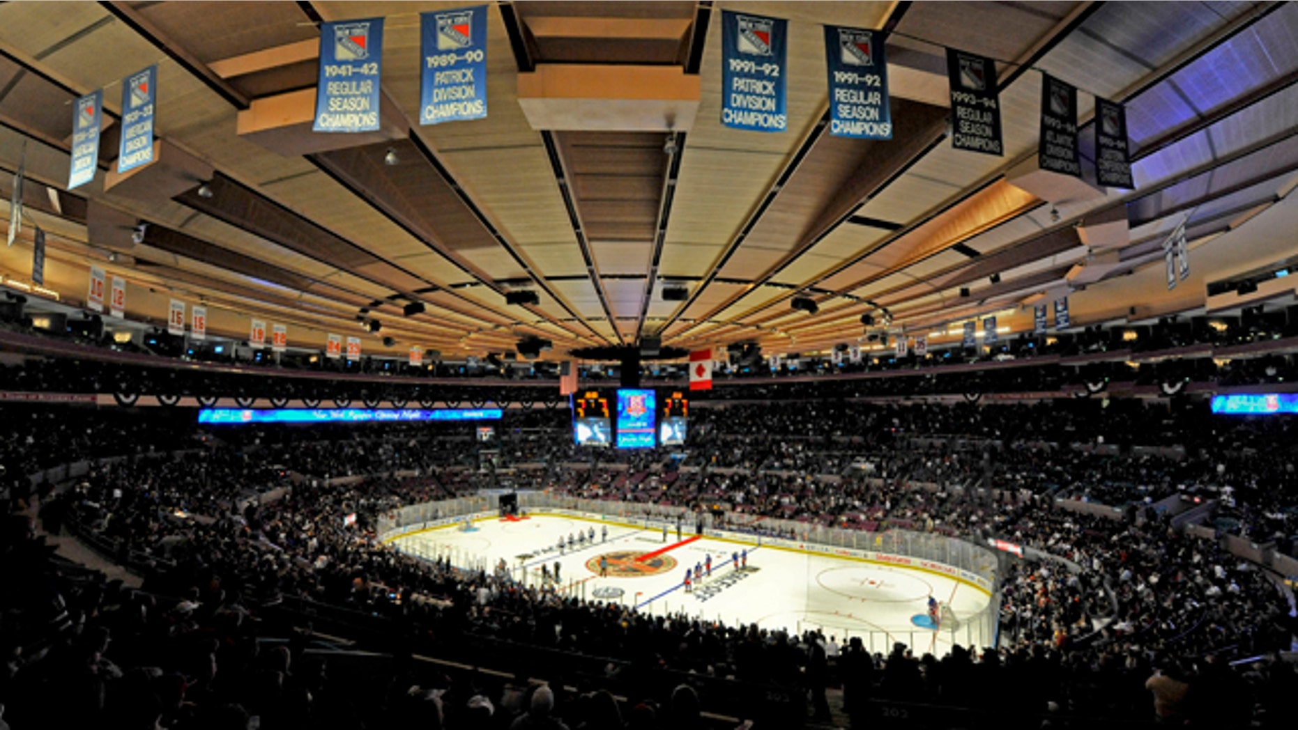 Oct. 15: The New York Rangers and the Toronto Maple Leafs line up for the singing of the each team's national anthems during opening night of the Rangers' NHL hockey season at Madison Square Garden in New York.