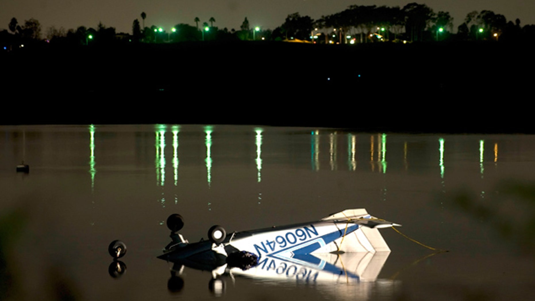 Nov. 21: Single engine plane rests in the shallow waters of Upper Newport Bay in Newport Beach, Calif.