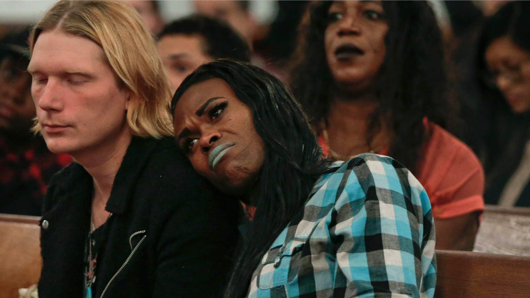 Nov. 18, 2015: a couple attending a Trans Day of Remembrance program, listen during a speech about violence against transgender people, in New York.