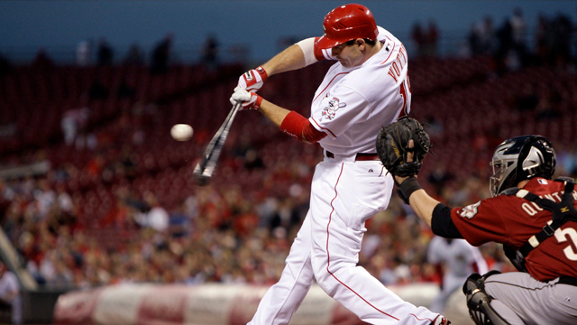 This Sept. 30, 2010, file photo shows Cincinnati Reds first baseman Joey Votto batting against the Houston Astros in a baseball game in Cincinnati.