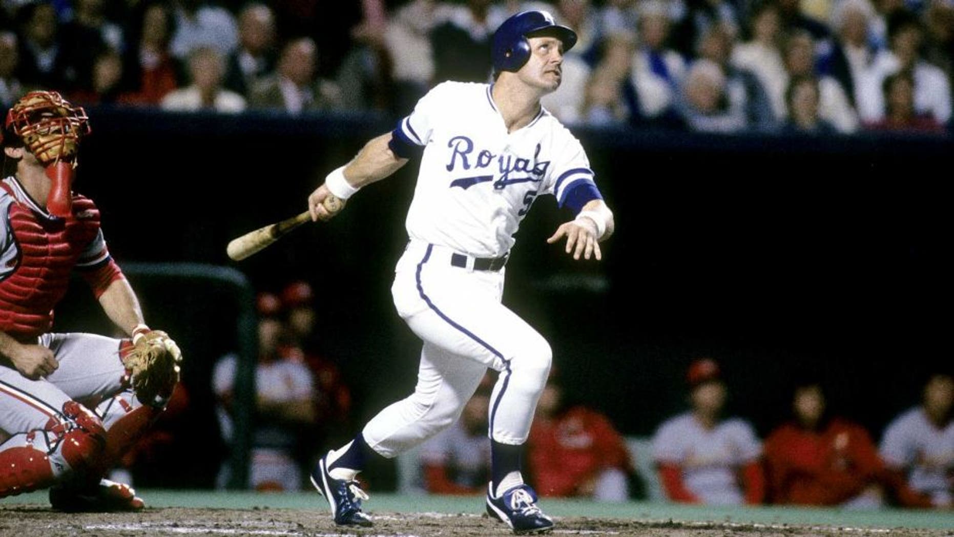 KANSAS CIT, MO - OCTOBER, 1985: Third baseman George Brett #5 swings and watches the flight of his ball against the St. Louis Cardinals in the World Series, October, 1985 at Royals Stadium in Kansas City, Missouri. The Royals won the series 4 games to 3. Brett played for the Royals from 1973-93. (Photo by Focus on Sport/Getty Images)