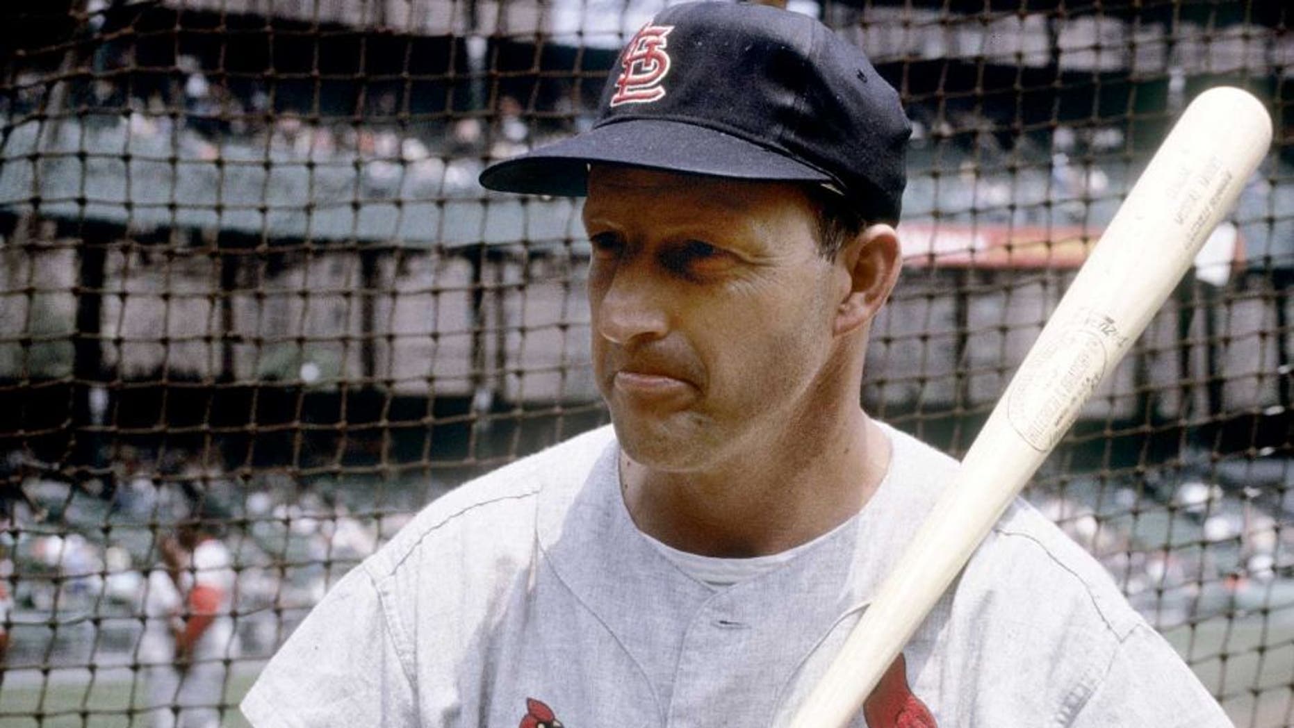 CIRCA 1960's: Outfielder/First Baseman Stan Musial of the St. Louis Cardinals with bat on shoulder infront of the batting cage before an early circa 1960's Major League Baseball game. sMusial played for the Cardinals from 1941-63. (Photo by Focus on Sport/Getty Images)