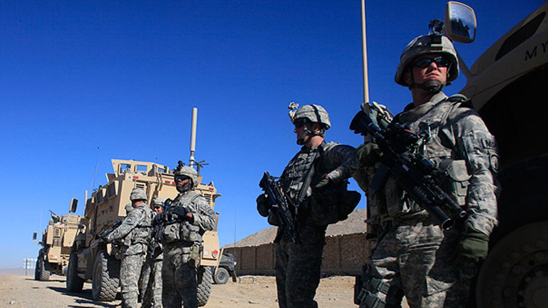 Nov. 19: U.S. Army soldiers stand next to their vehicles at a checkpoint near the town of Balisal Afghan, Afghanistan. (AP)