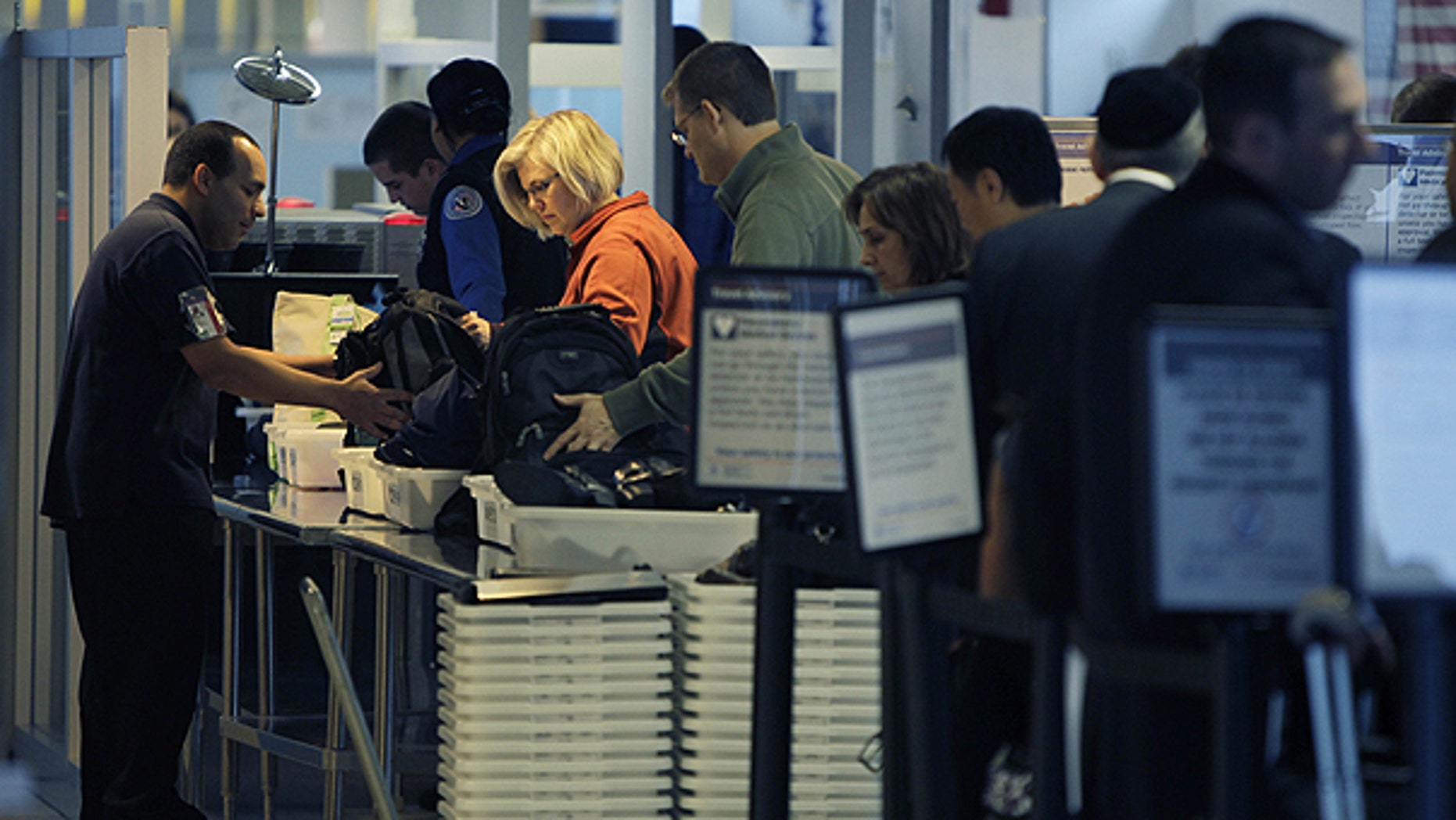 Nov. 23: Travelers make their way through a security checkpoint at LaGuardia Airport in New York.