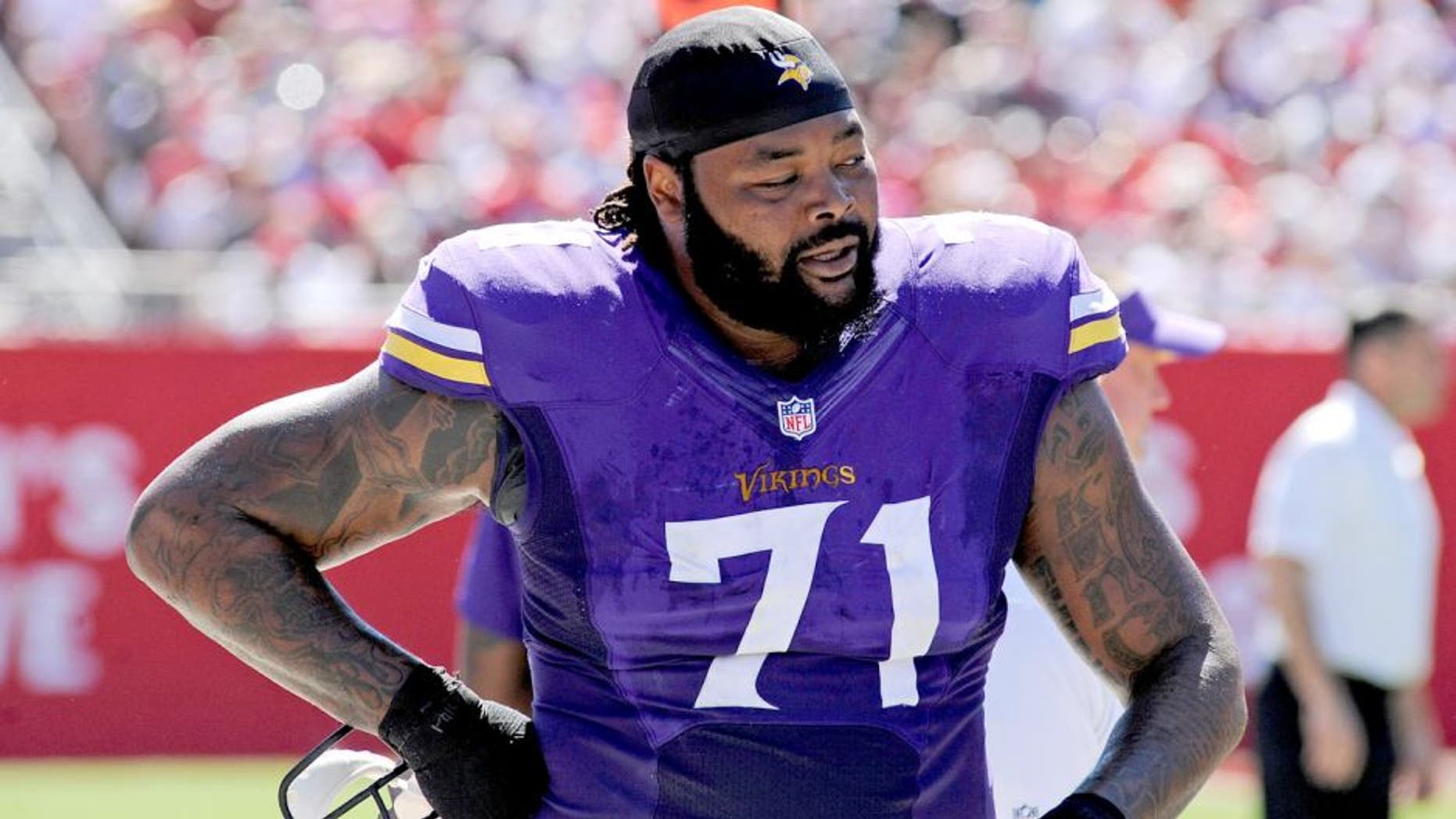 Oct 26, 2014; Tampa, FL, USA; Minnesota Vikings tackle Phil Loadholt (71) walks on the sidelines against the Tampa Bay Buccaneers at Raymond James Stadium. Mandatory Credit: David Manning-USA TODAY Sports