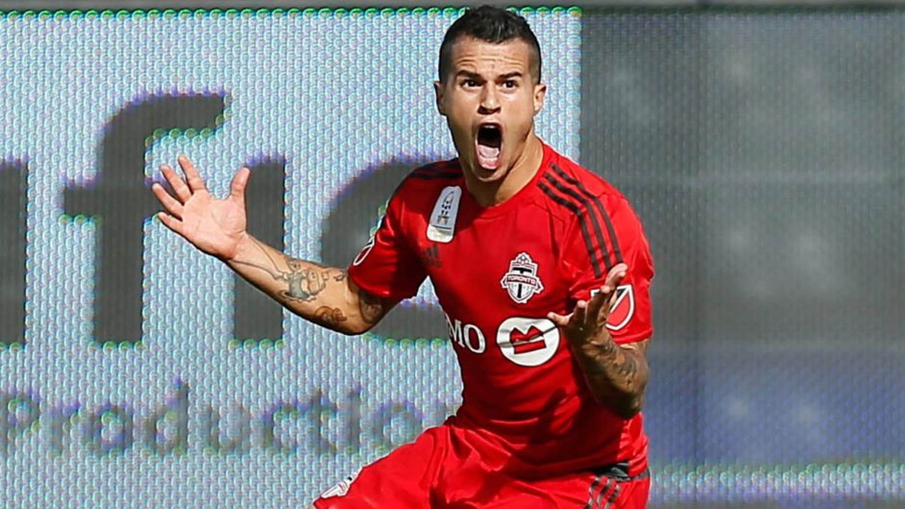 Sep 26, 2015; Toronto, Ontario, CAN; Toronto FC forward Sebastian Giovinco (10) questions a call for the Chicago Fire at BMO Field. Toronto defeated Chicago 3-2. Mandatory Credit: John E. Sokolowski-USA TODAY Sports