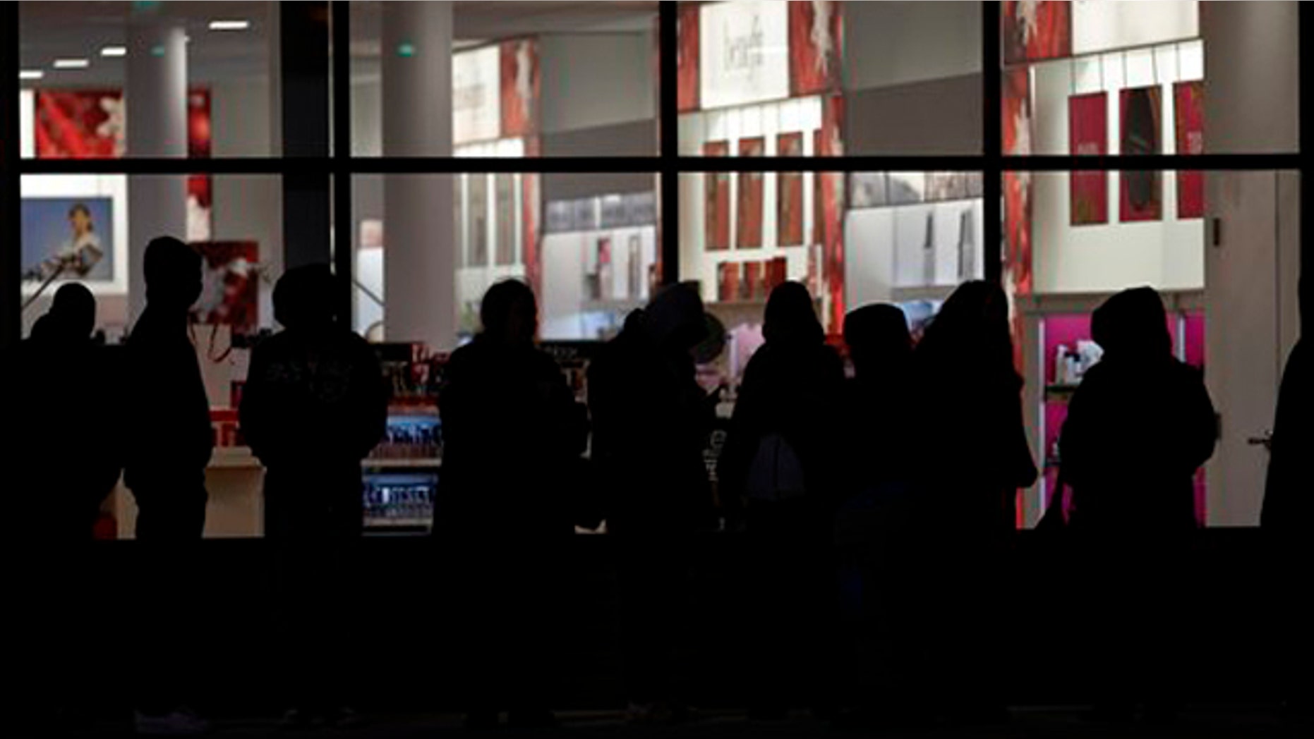 November 24, 2011: Early bird shoppers wait in a long line to get into the midnight opening of an Old Navy store in Mayfield Hts., Ohio.
