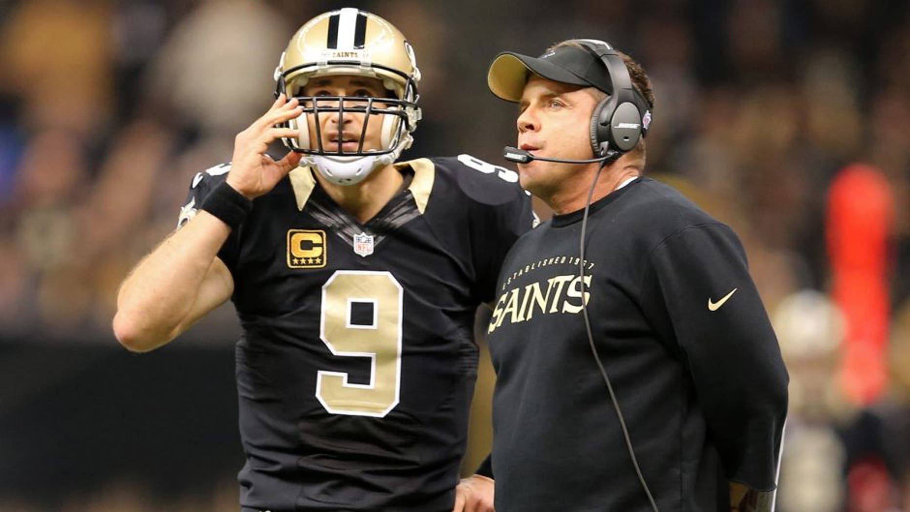 Nov 24, 2014; New Orleans, LA, USA; New Orleans Saints quarterback Drew Brees (9) talks to head coach Sean Payton in the first quarter of their game against the Baltimore Ravens at the Mercedes-Benz Superdome. Mandatory Credit: Chuck Cook-USA TODAY Sports