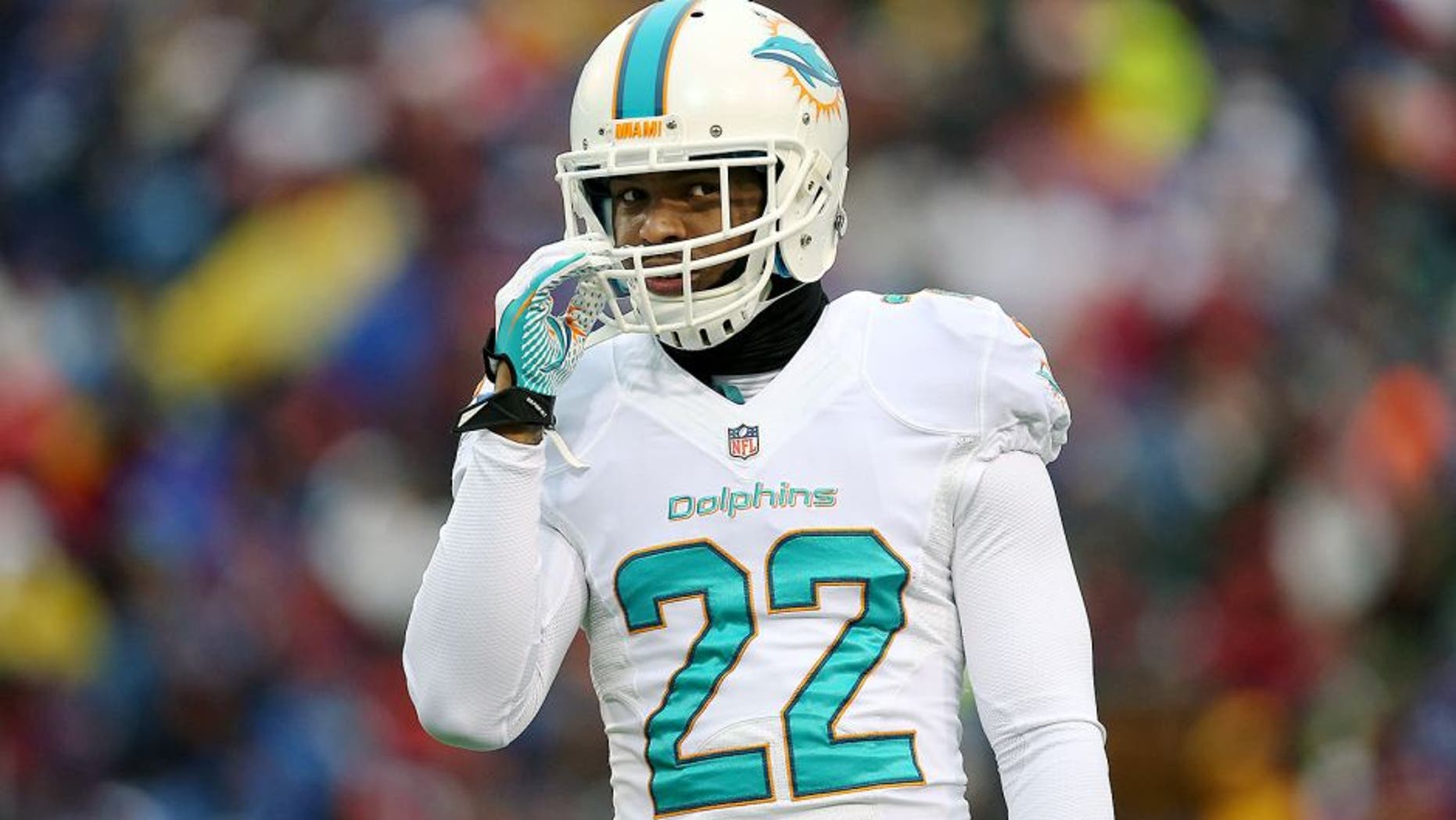 ORCHARD PARK, NY - DECEMBER 22: Jamar Taylor #22 of the Miami Dolphins during NFL game action against the Buffalo Bills at Ralph Wilson Stadium on December 22, 2013 in Orchard Park, New York. (Photo by Tom Szczerbowski/Getty Images)