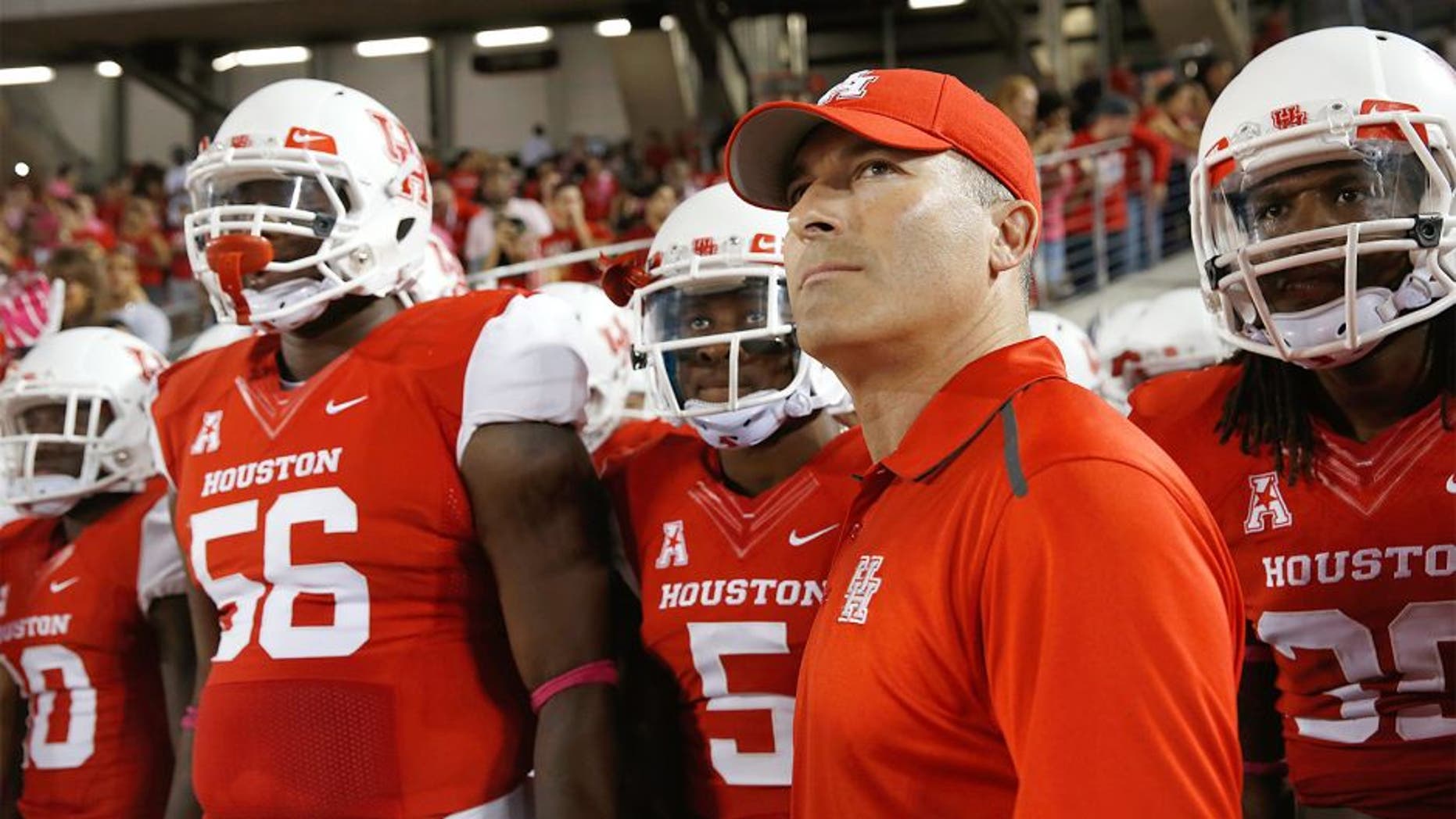 HOUSTON, TX - OCTOBER 17: Head coach of the Houston Cougars Tony Levine waits with his team prior to the start of their game against the Temple Owls at TDECU Stadium on October 17, 2014 in Houston, Texas. (Photo by Scott Halleran/Getty Images)