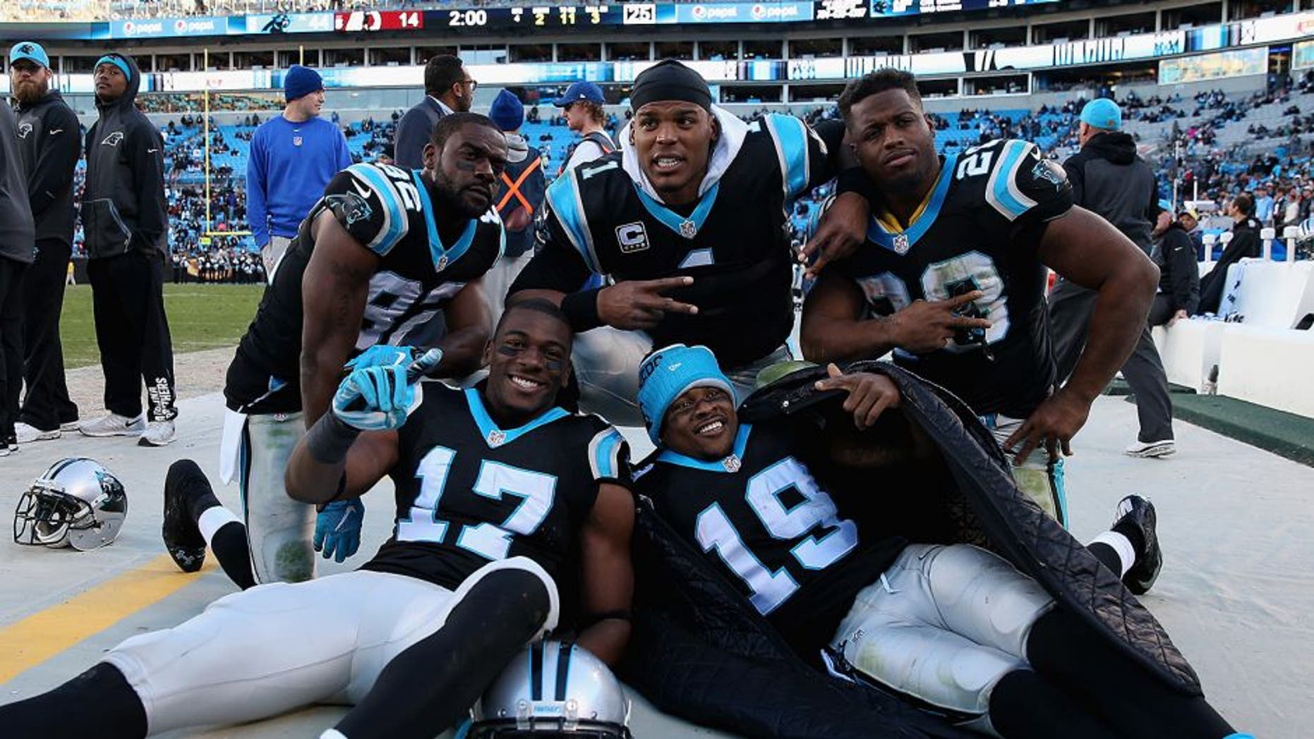 CHARLOTTE, NC - NOVEMBER 22: Teammates Jerricho Cotchery #82, Devin Funchess #17, Ted Ginn #19, Jonathan Stewart #28 and Cam Newton #1 of the Carolina Panthers celebrate after defeating the Washington Redskins 44-16 at Bank of America Stadium on November 22, 2015 in Charlotte, North Carolina. (Photo by Streeter Lecka/Getty Images)