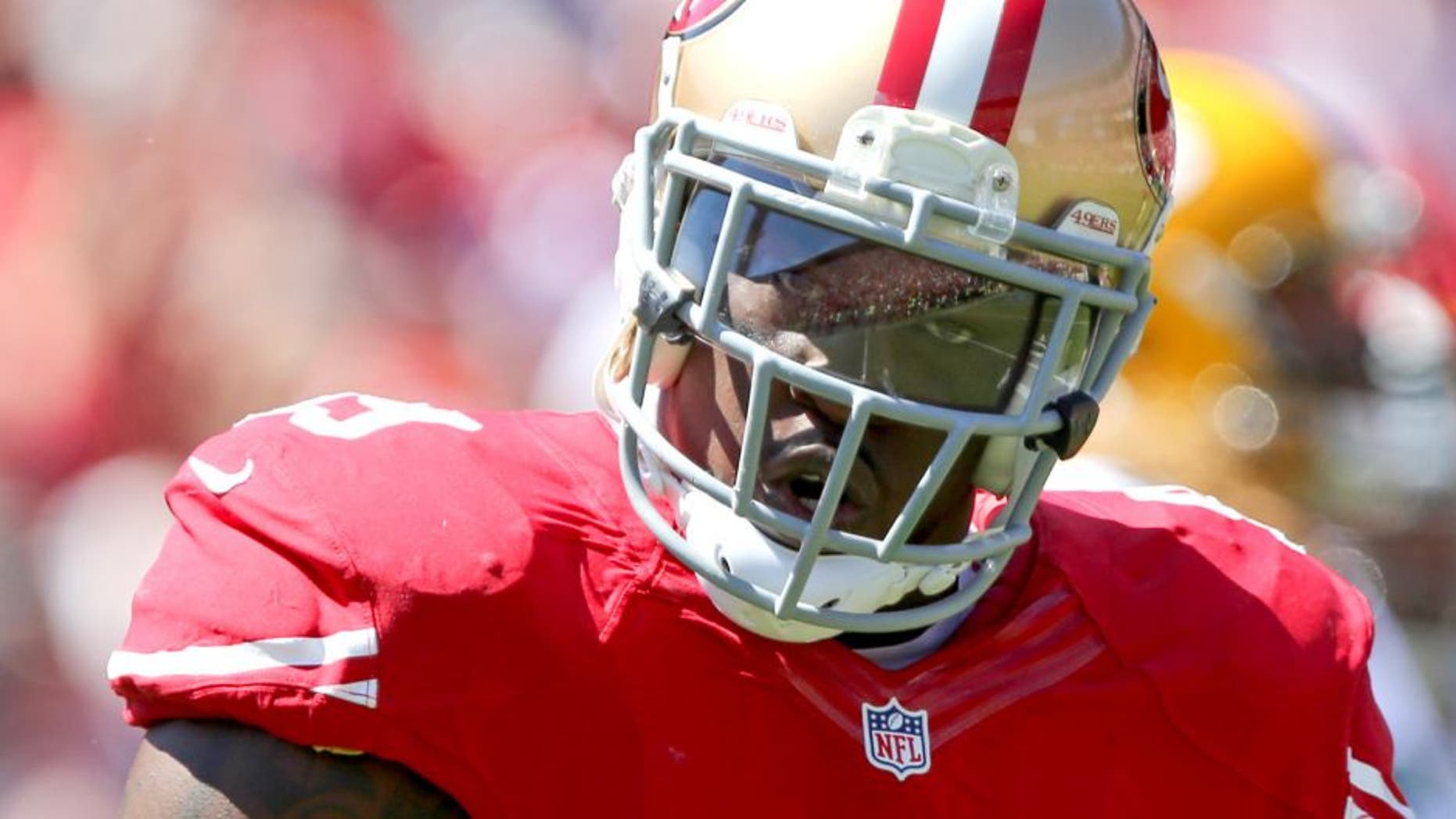 Sep 8, 2013; San Francisco, CA, USA; San Francisco 49ers linebacker Aldon Smith (99) after a sack against the Green Bay Packers during the first quarter at Candlestick Park. Mandatory Credit: Kelley L Cox-USA TODAY Sports