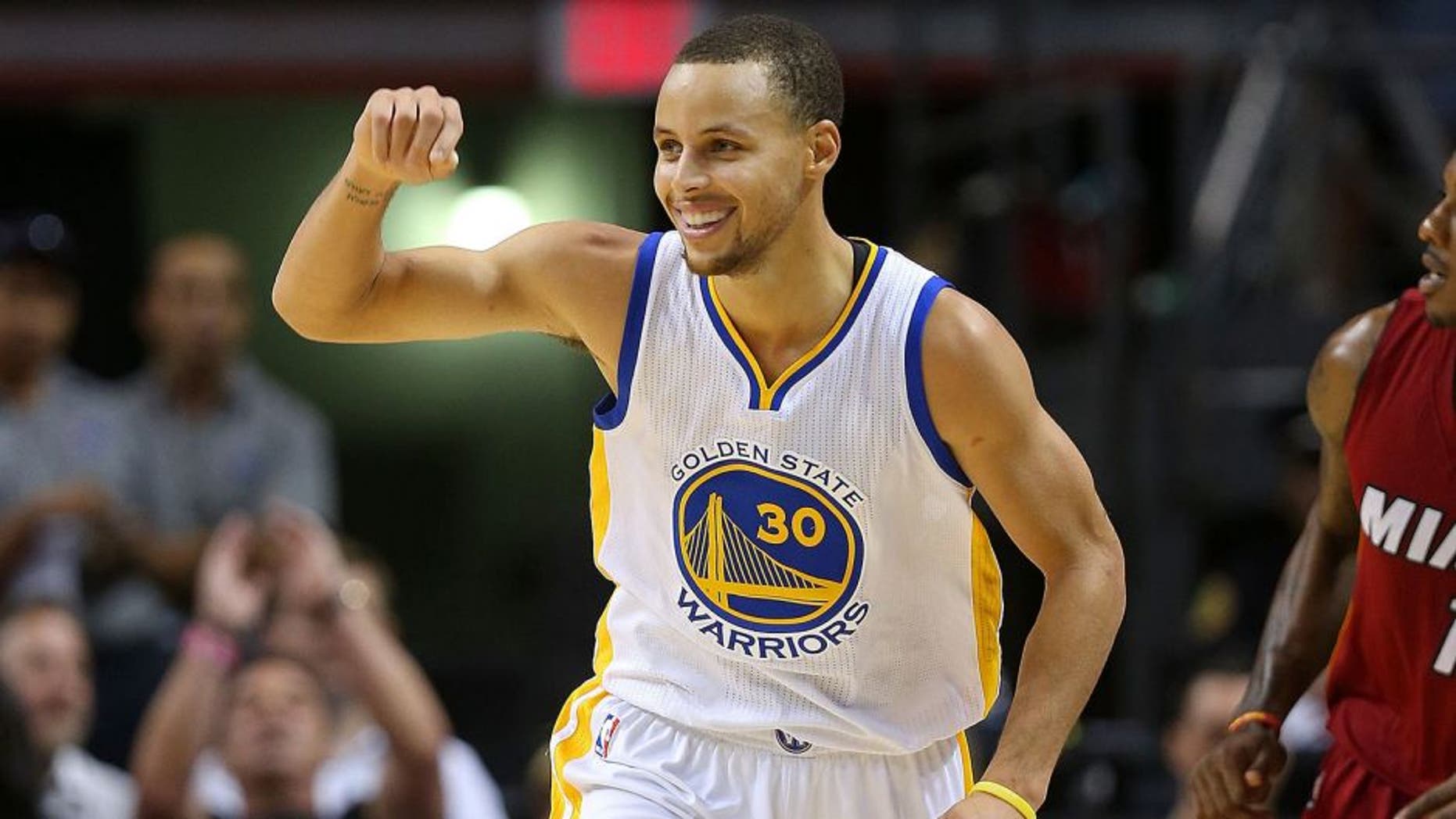 MIAMI, FL - NOVEMBER 25: Stephen Curry #30 of the Golden State Warriors reacts to a play during a game against the Miami Heat at American Airlines Arena on November 25, 2014 in Miami, Florida. NOTE TO USER: User expressly acknowledges and agrees that, by downloading and/or using this photograph, user is consenting to the terms and conditions of the Getty Images License Agreement. Mandatory copyright notice: (Photo by Mike Ehrmann/Getty Images)