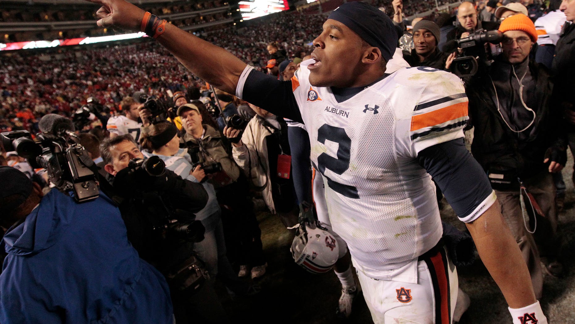 Nov. 26: Auburn quarterback Cameron Newton celebrates after their 28-27 win over Alabama in an NCAA college football game at Bryant-Denny Stadium in Tuscaloosa, Ala.