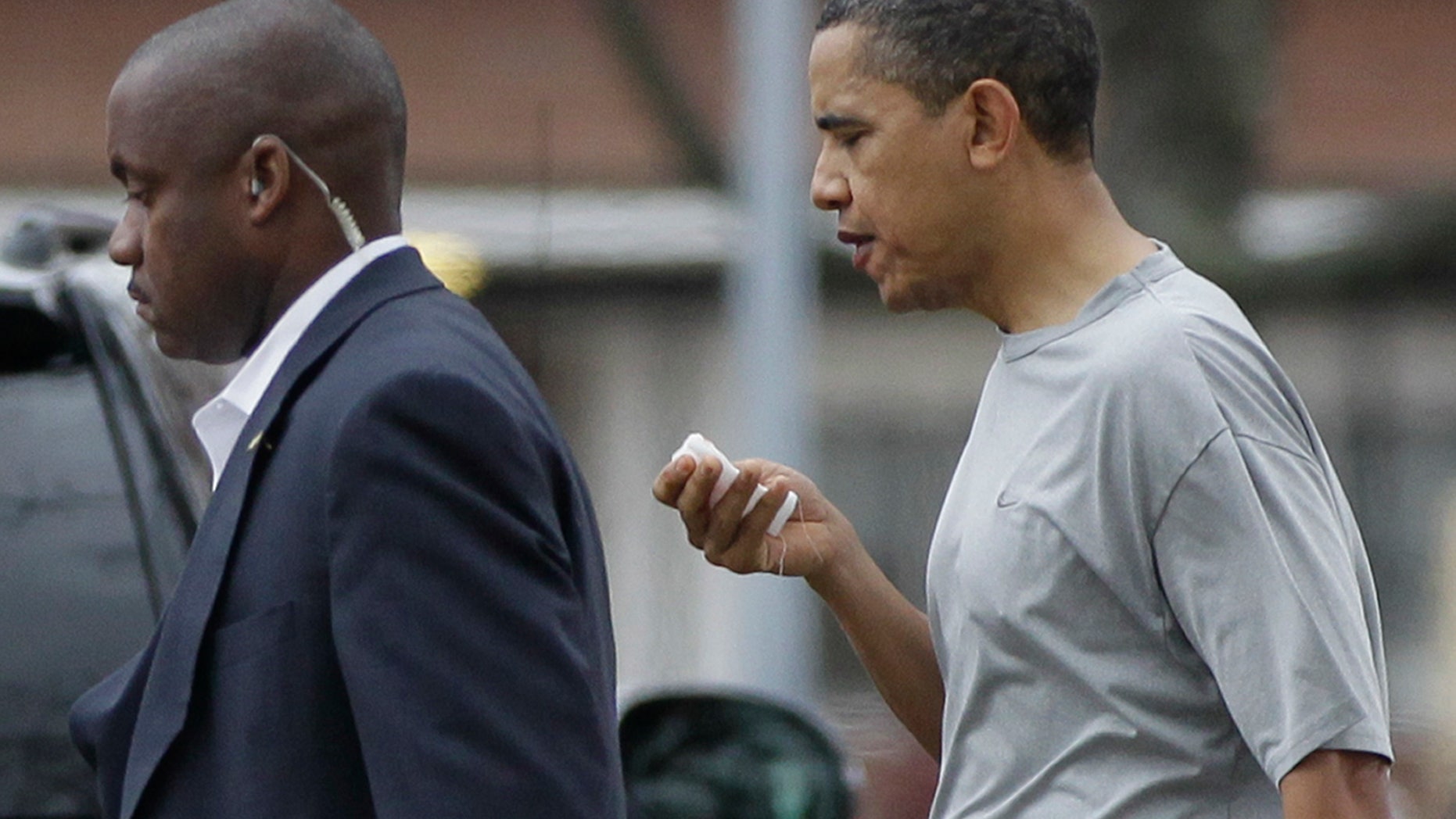 Nov. 26: President Obama walks with a U.S. Secret Service agent back to his vehicle after playing a private game of basketball at Fort McNair in Washington.