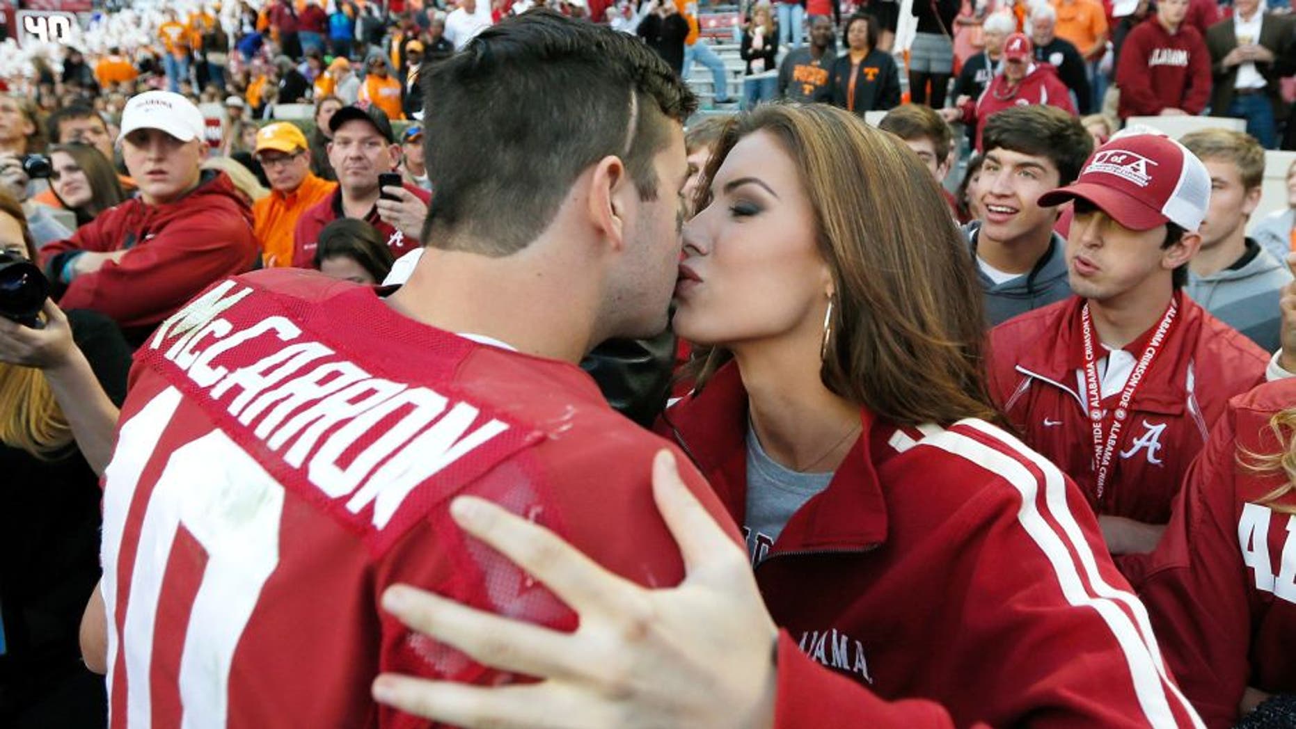 TUSCALOOSA, AL - OCTOBER 26: AJ McCarron #10 of the Alabama Crimson Tide kisses girlfriend Katherine Webb after their 45-10 win over the Tennessee Volunteers at Bryant-Denny Stadium on October 26, 2013 in Tuscaloosa, Alabama. (Photo by Kevin C. Cox/Getty Images)