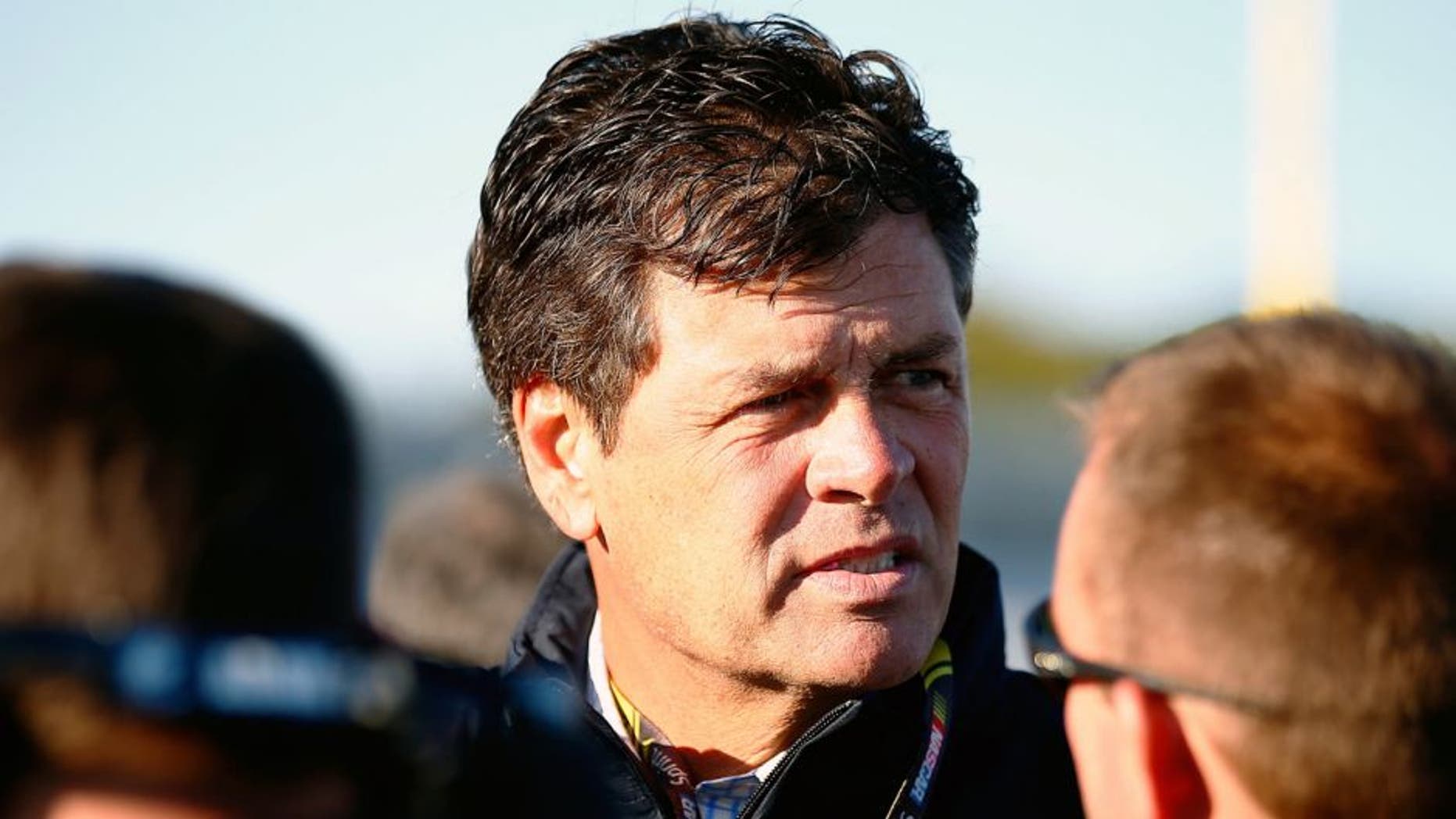 LOUDON, NH - SEPTEMBER 19: Team owner Michael Waltrip looks on during qualifying for the NASCAR Sprint Cup Series Sylvania 300 at New Hampshire Motor Speedway on September 19, 2014 in Loudon, New Hampshire. (Photo by Jared Wickerham/Getty Images)