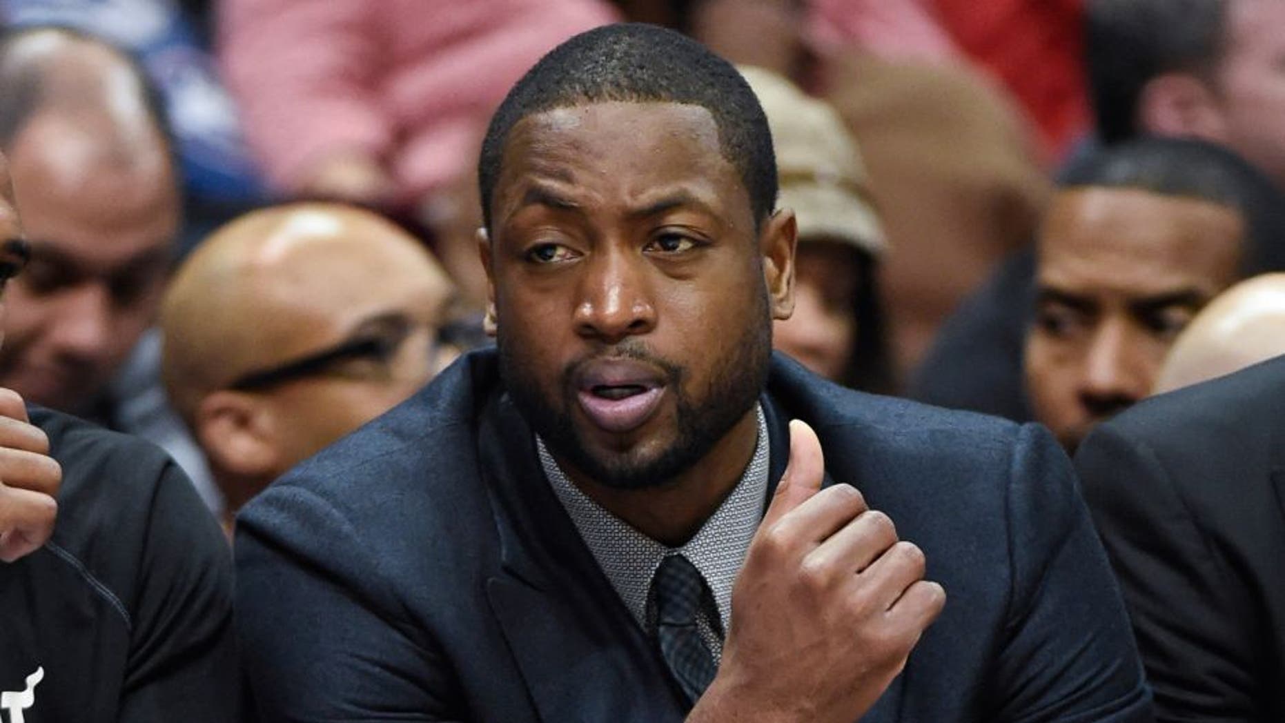 Nov 14, 2014; Atlanta, GA, USA; Miami Heat guard Dwyane Wade (3) shown on the bench in street clothes during the game against the Atlanta Hawks during the second half at Philips Arena. The Hawks defeated the Heat 114-103. Mandatory Credit: Dale Zanine-USA TODAY Sports