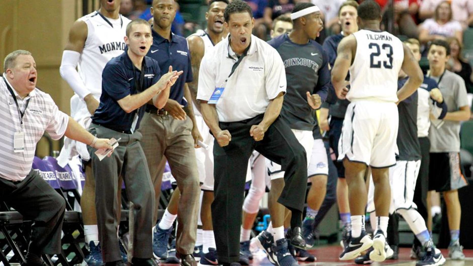 Nov 26, 2015; Lake Buena Vista, FL, USA; Monmouth Hawks head coach King Rice reacts against the Notre Dame Fighting Irish during the second half at ESPN Wide World of Sports Complex. Monmouth beat Notre Dame 70-68. Mandatory Credit: Kim Klement-USA TODAY Sports