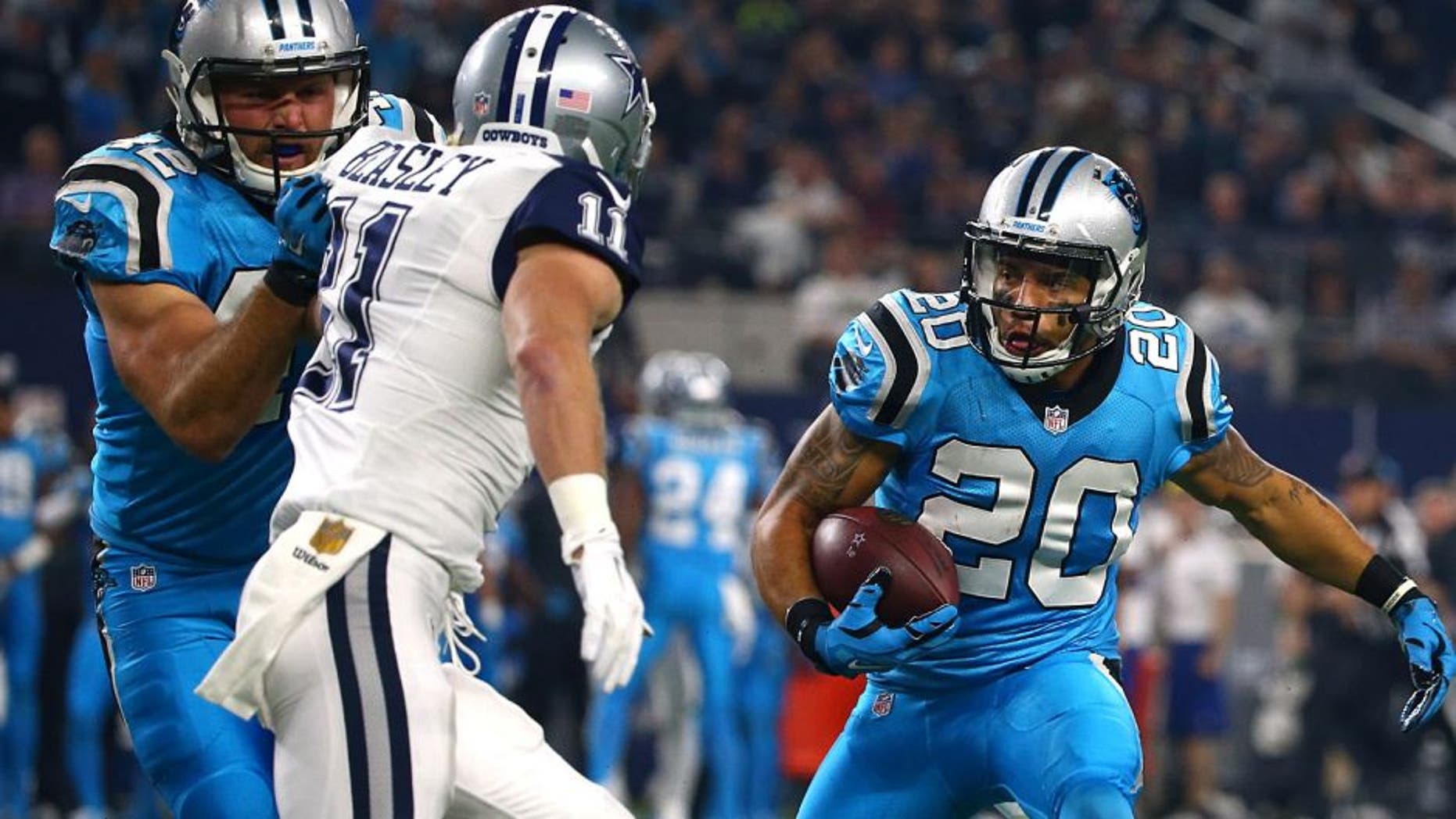 ARLINGTON, TX - NOVEMBER 26: Kurt Coleman #20 of the Carolina Panthers returns an interception for a touchdown against Cole Beasley #11 of the Dallas Cowboys in the first quarter at AT&T Stadium on November 26, 2015 in Arlington, Texas. (Photo by Tom Pennington/Getty Images)