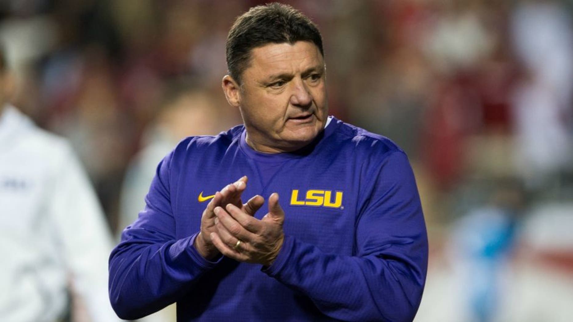 Nov 12, 2016; Fayetteville, AR, USA; LSU Tigers head coach Ed Orgeron walks onto the field to watch his players warmup before the game against the Arkansas Razorbacks at Donald W. Reynolds Razorback Stadium. Mandatory Credit: Brett Rojo-USA TODAY Sports