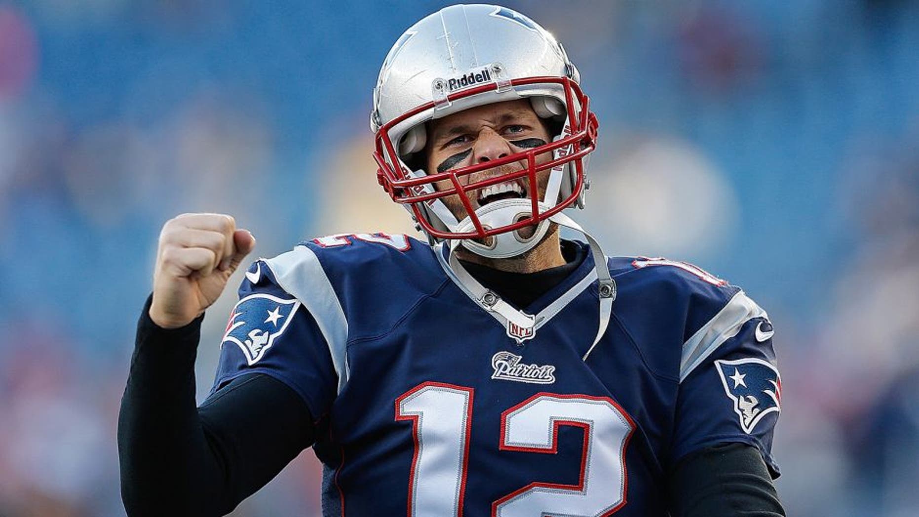 FOXBORO, MA - NOVEMBER 3: Tom Brady #12 of the New England Patriots reacts to the cheers of fans as he runs onto the field before a game with the Pittsburgh Steelers at Gillette Stadium on November 3, 2013 in Foxboro, Massachusetts. (Photo by Jim Rogash/Getty Images)