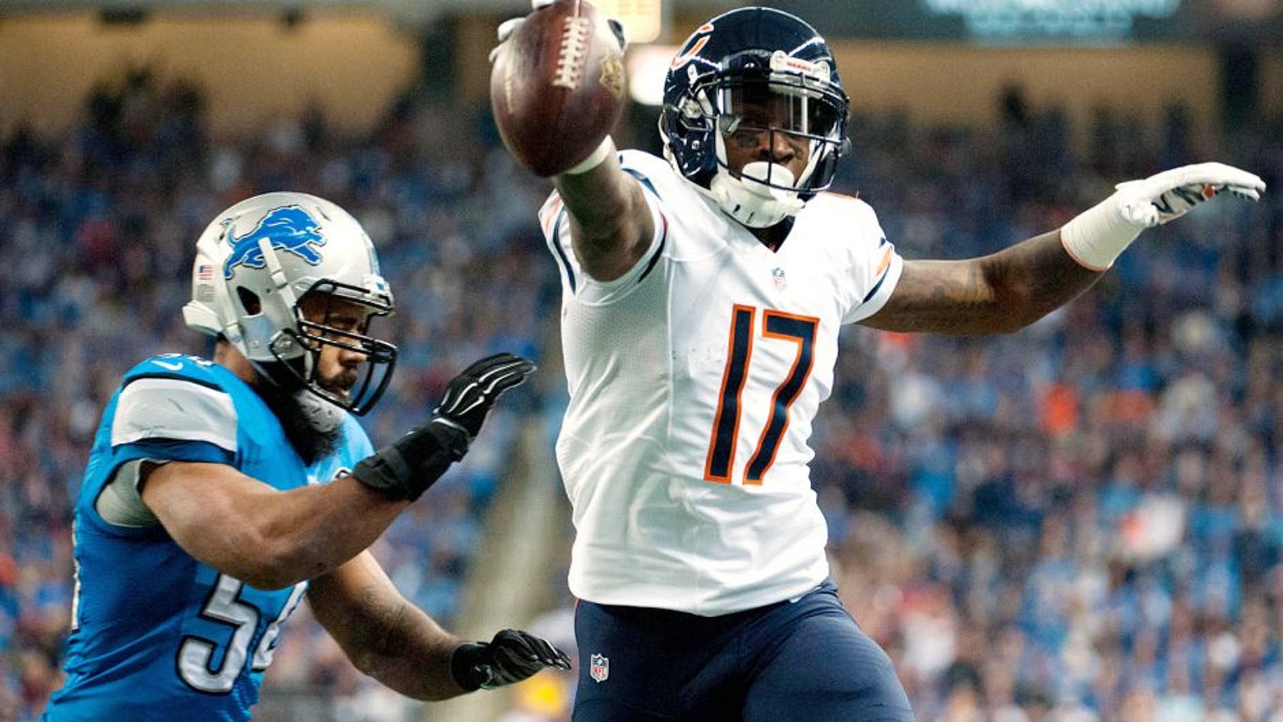Nov 27, 2014; Detroit, MI, USA; Chicago Bears wide receiver Alshon Jeffery (17) runs past Detroit Lions outside linebacker DeAndre Levy (54) to score a touchdown during the first quarter at Ford Field. Mandatory Credit: Tim Fuller-USA TODAY Sports