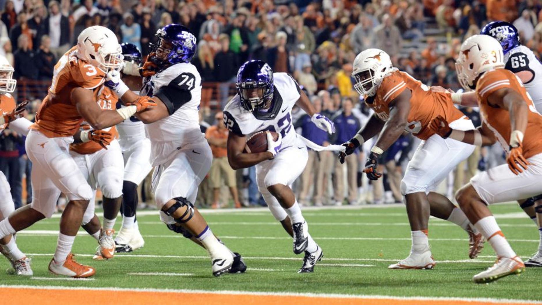 Nov 27, 2014; Austin, TX, USA; TCU Horned Frogs running back Aaron Green (22) scores a touchdown against the Texas Longhorns during the game at Darrell K Royal-Texas Memorial Stadium. Mandatory Credit: Brendan Maloney-USA TODAY Sports