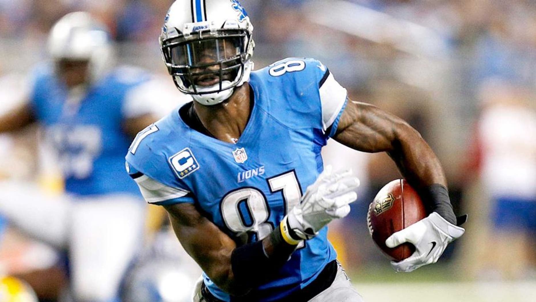 DETROIT, MI - NOVEMBER 28: Calvin Johnson #81 of the Detroit Lions runs for a third quarter touchdown while playing the Green Bay Packers at Ford Field on November 28, 2013 in Detroit, Michigan. (Photo by Gregory Shamus/Getty Images)