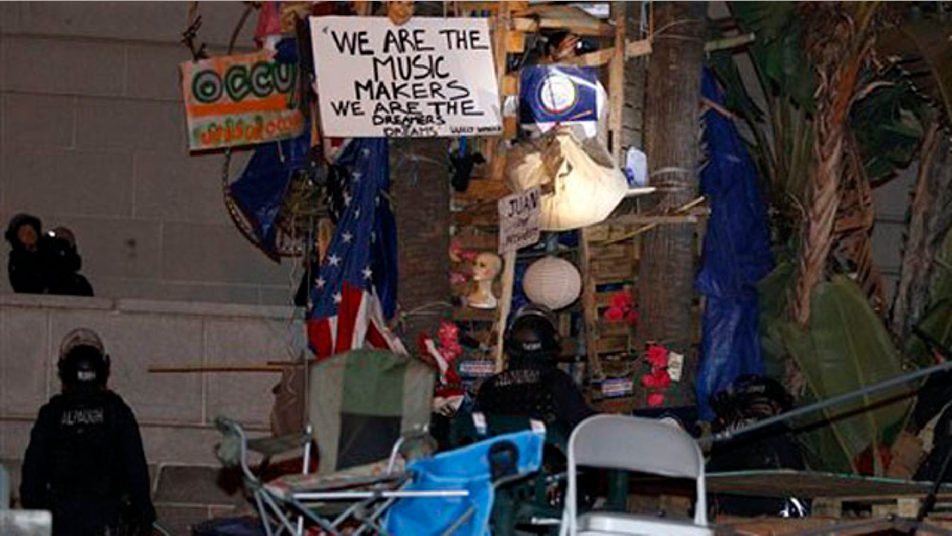 November 30, 2011: Police prepare to remove a structure at the Occupy Los Angeles encampment outside City Hall in Los Angeles .
