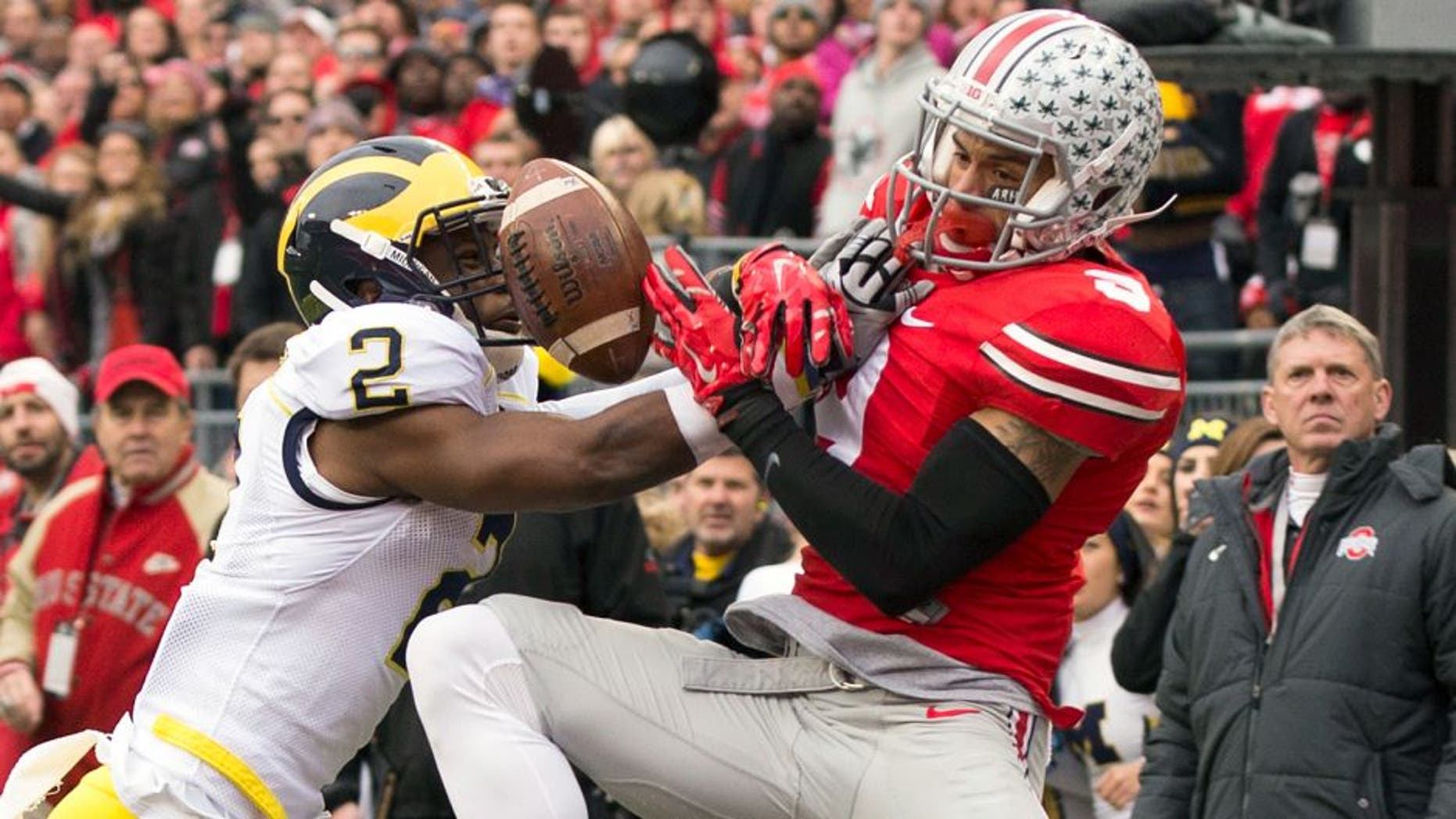 Nov 29, 2014; Columbus, OH, USA; Michigan Wolverines defensive back Blake Countess (2) breaks up a pass intended for Ohio State Buckeyes wide receiver Devin Smith (9) at Ohio Stadium. Mandatory Credit: Greg Bartram-USA TODAY Sports