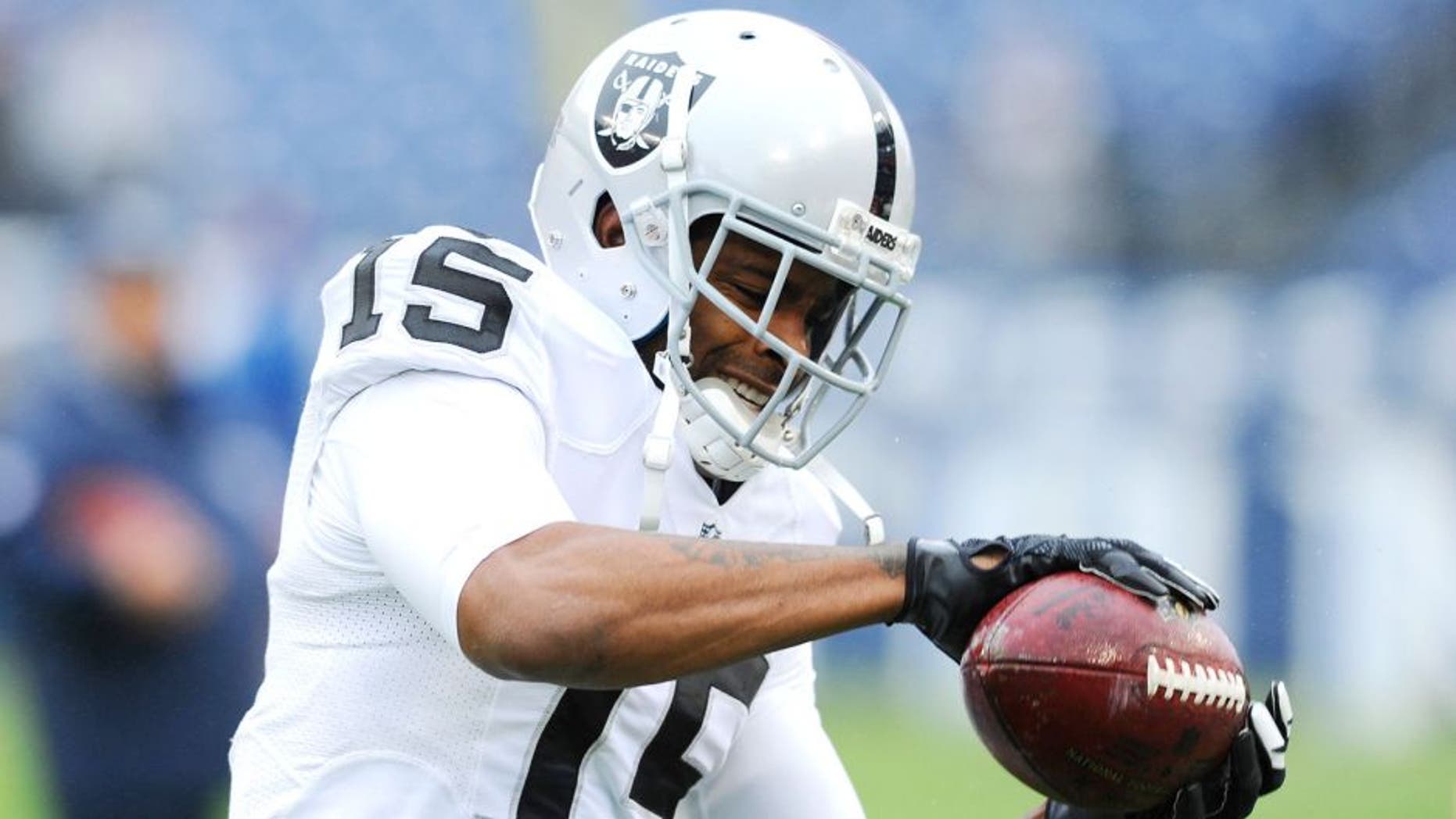 Nov 29, 2015; Nashville, TN, USA; Oakland Raiders receiver Michael Crabtree (15) catches the ball prior to the game against the Tennessee Titans at Nissan Stadium. Mandatory Credit: Christopher Hanewinckel-USA TODAY Sports