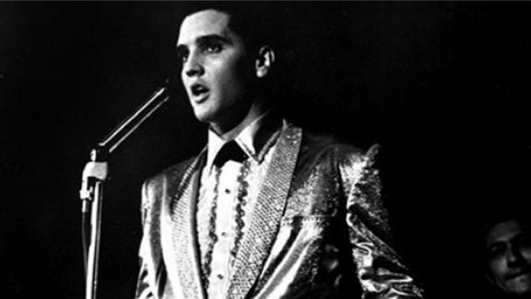 In this photo taken March 25, 1961 and provided by the World War II Valor in the Pacific National Monument, Elvis Presley performs at the Bloch Arena on the Pearl Harbor Navel base in Honolulu, Hawaii. Fifty years ago, Elvis Presley helped raise money and bring attention to help build the USS Arizona Memorial. The King is being asked to deliver one more time. (AP Photo/ Word War II Valor in the Pacific National Monument)