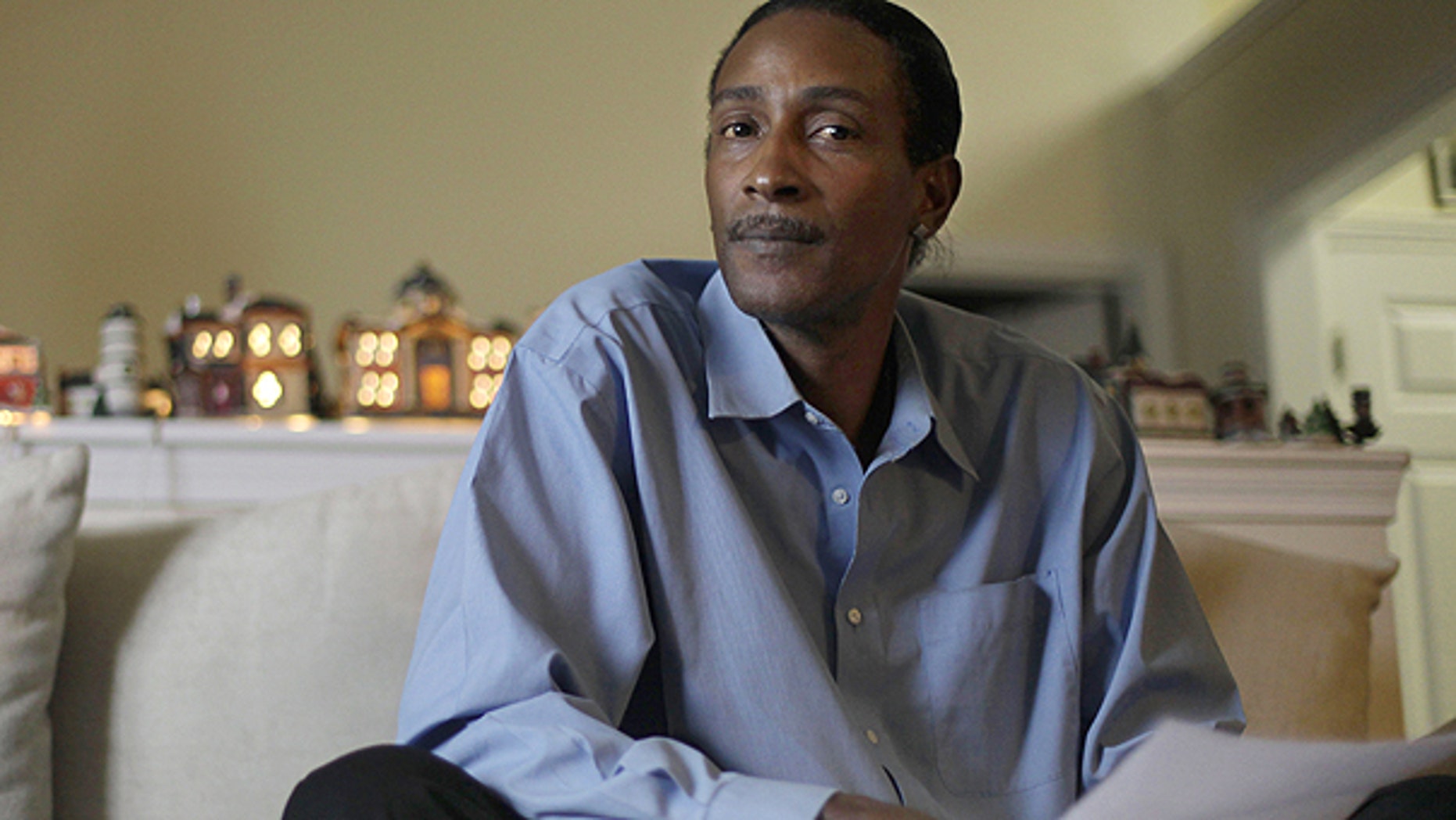 Nov. 30: Wayne Pittman, 46, sits in his Lawrenceville, Ga., home looking over unemployment papers as his extended benefits are set to expire unless Congress passes a vote to extend them.