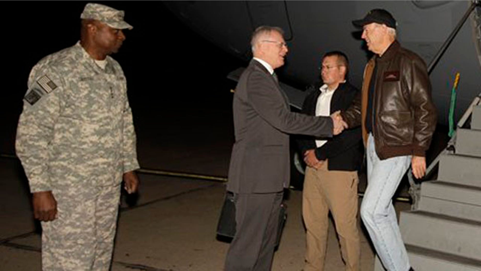 November 29, 2011: Gen. Lloyd Austin, the top U.S. commander in Iraq, right, looks on as U.S. Vice President Joe Biden, left, shake hands with the U.S. Ambassador to Iraq James Jeffrey after he arrived, in Baghdad, Iraq.