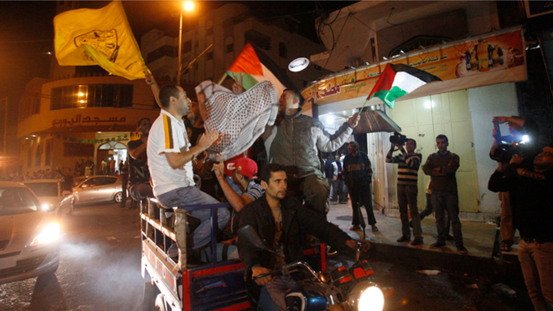 Nov. 21, 2012: Palestinians celebrate the cease-fire agreement between Israel and Hamas in Gaza City.