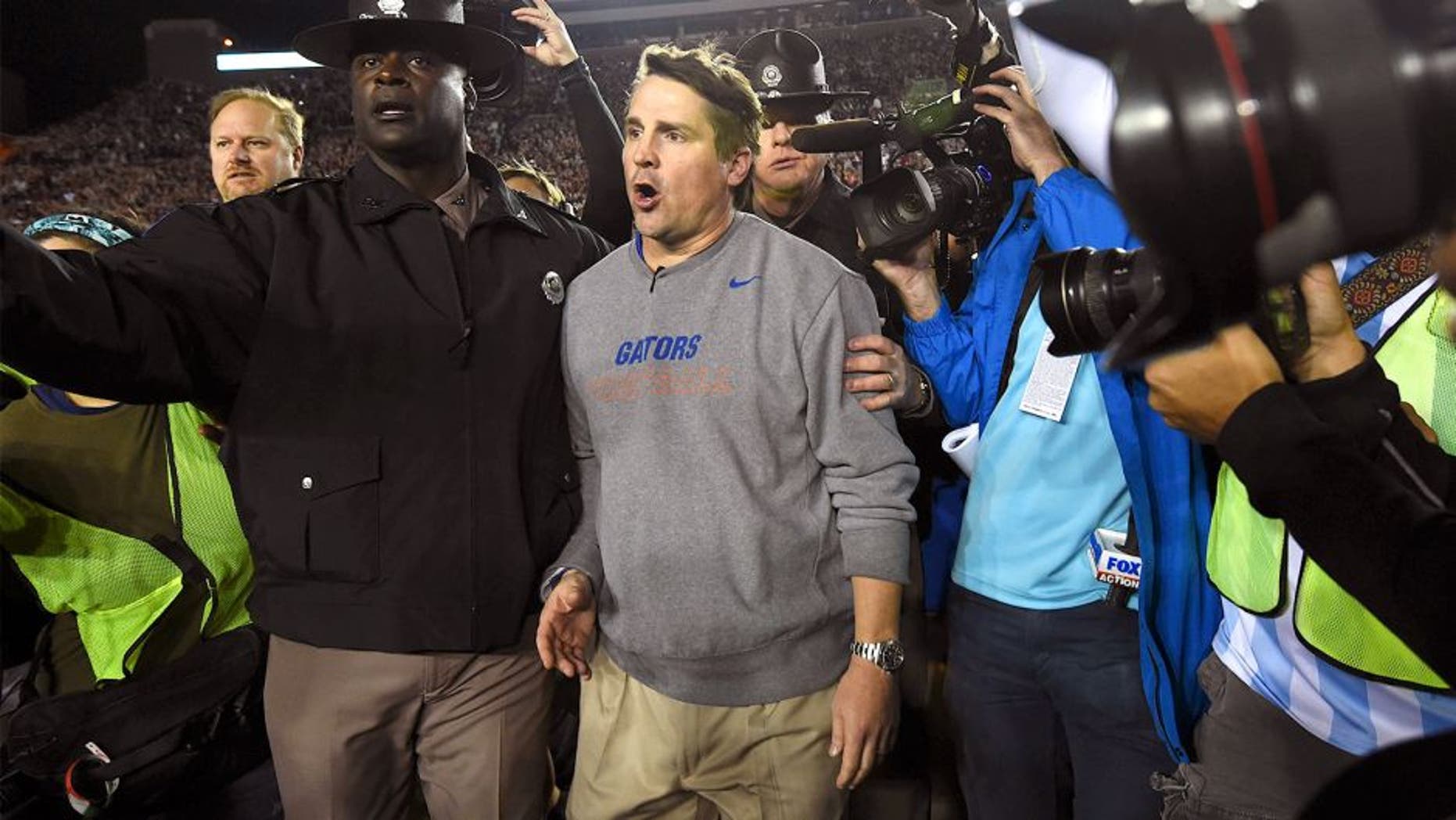 Nov 29, 2014; Tallahassee, FL, USA; Florida Gators head coach Will Muschamp walks off the field after the game at Doak Campbell Stadium. Florida State Seminoles defeated Florida Gators 24-19. Mandatory Credit: Tommy Gilligan-USA TODAY Sports