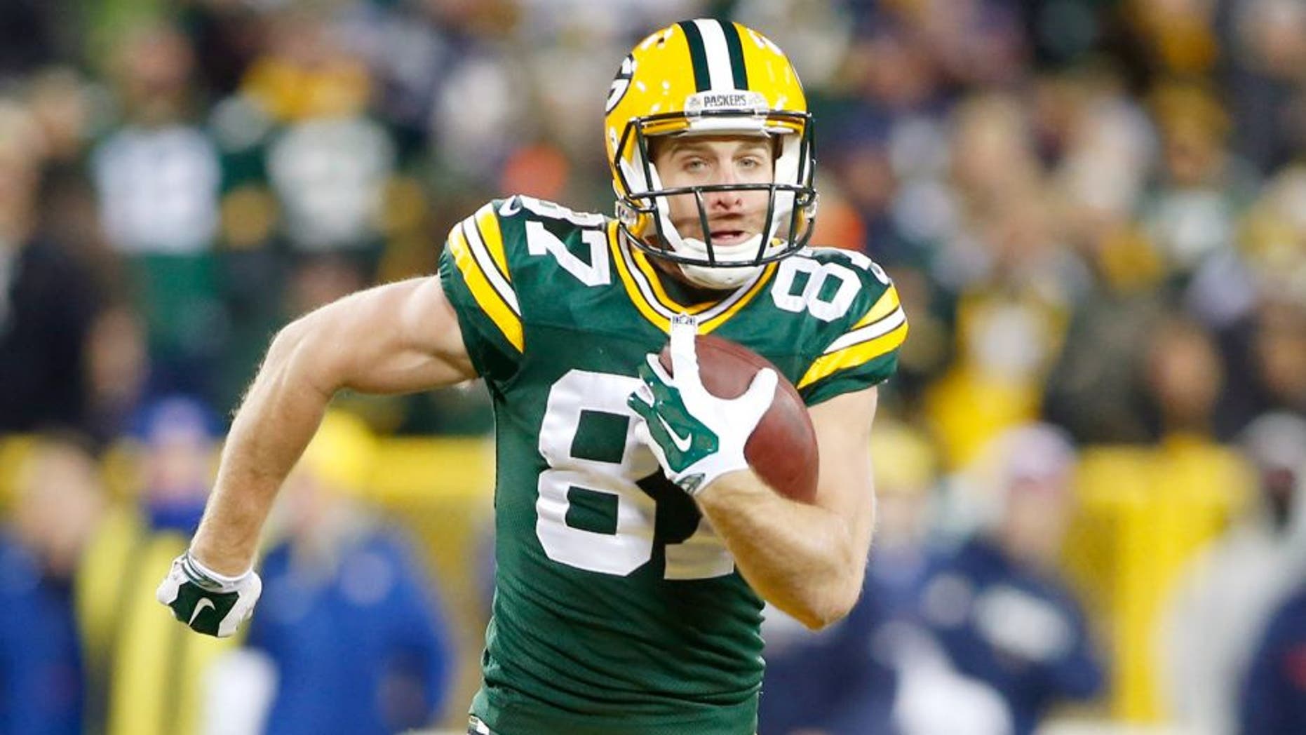 Nov 30, 2014; Green Bay, WI, USA; Green Bay Packers wide receiver Jordy Nelson (87) catches a touchdown pass during the first half against the New England Patriots at Lambeau Field. Mandatory Credit: Chris Humphreys-USA TODAY Sports