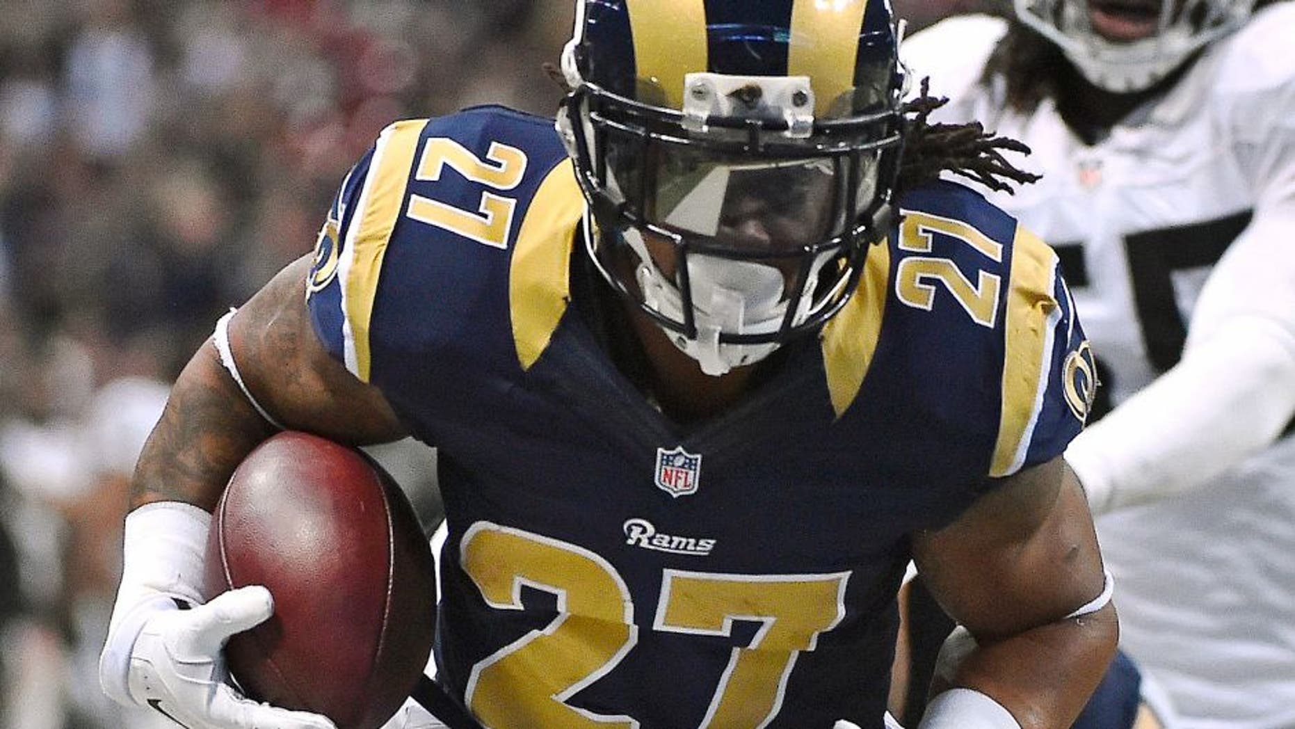 Nov 30, 2014; St. Louis, MO, USA; St. Louis Rams running back Tre Mason (27) runs in for a touchdown against the Oakland Raiders during the first half at the Edward Jones Dome. Mandatory Credit: Jasen Vinlove-USA TODAY Sports