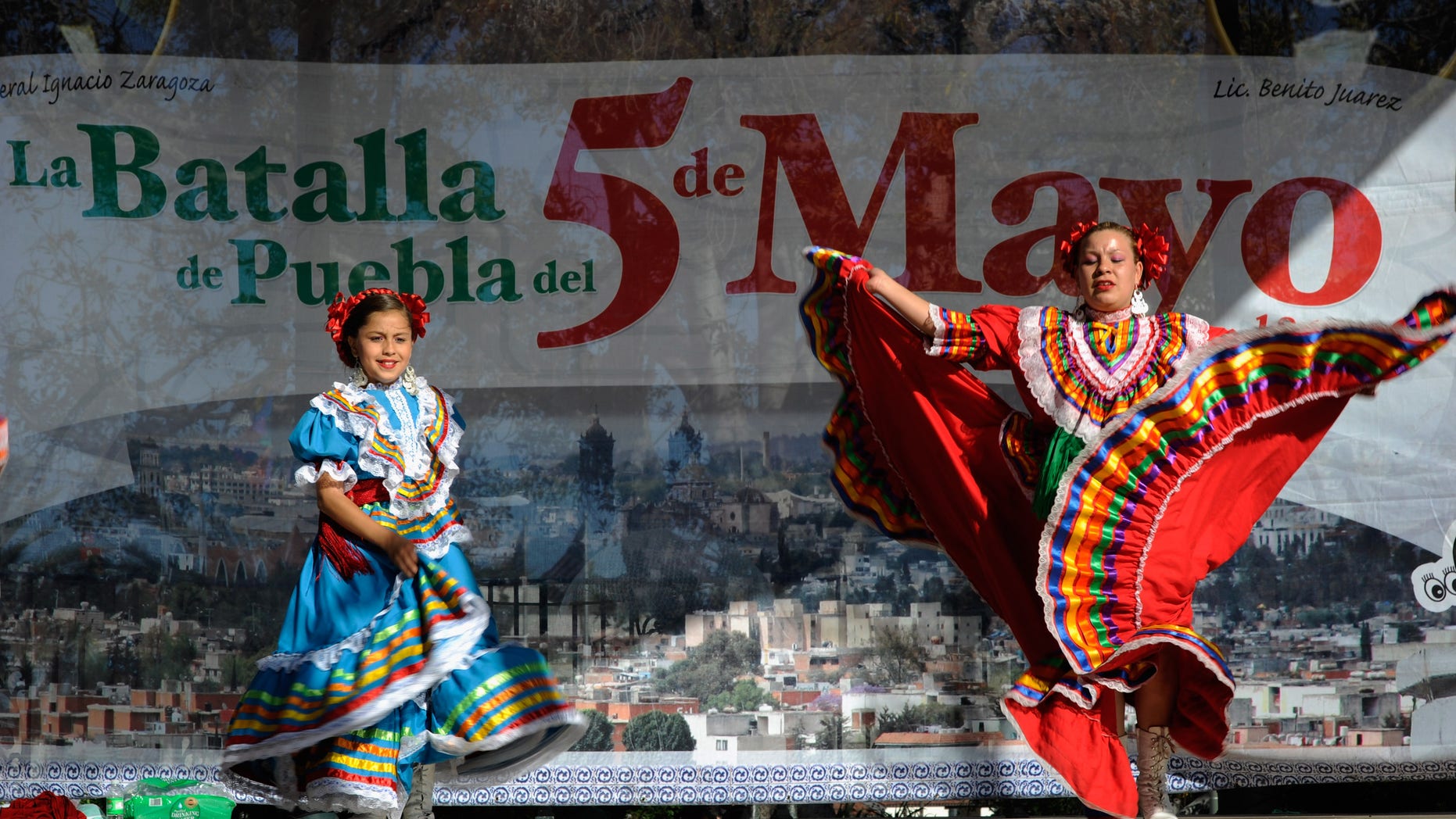 LOS ANGELES, CA - MAY 05: Aracely Saucillo (L) and Marylin Castillo perform with Mexica Ballet Folclorico performs during Cinco De Mayo festivities on May 5, 2011 at El Pueblo de Los Angeles Historic Site on Olvera Street in downtown Los Angeles, California. Cinco de Mayo celebrates the 1862 Mexican victory over the French in the Battle of Puebla. (Photo by Kevork Djansezian/Getty Images)