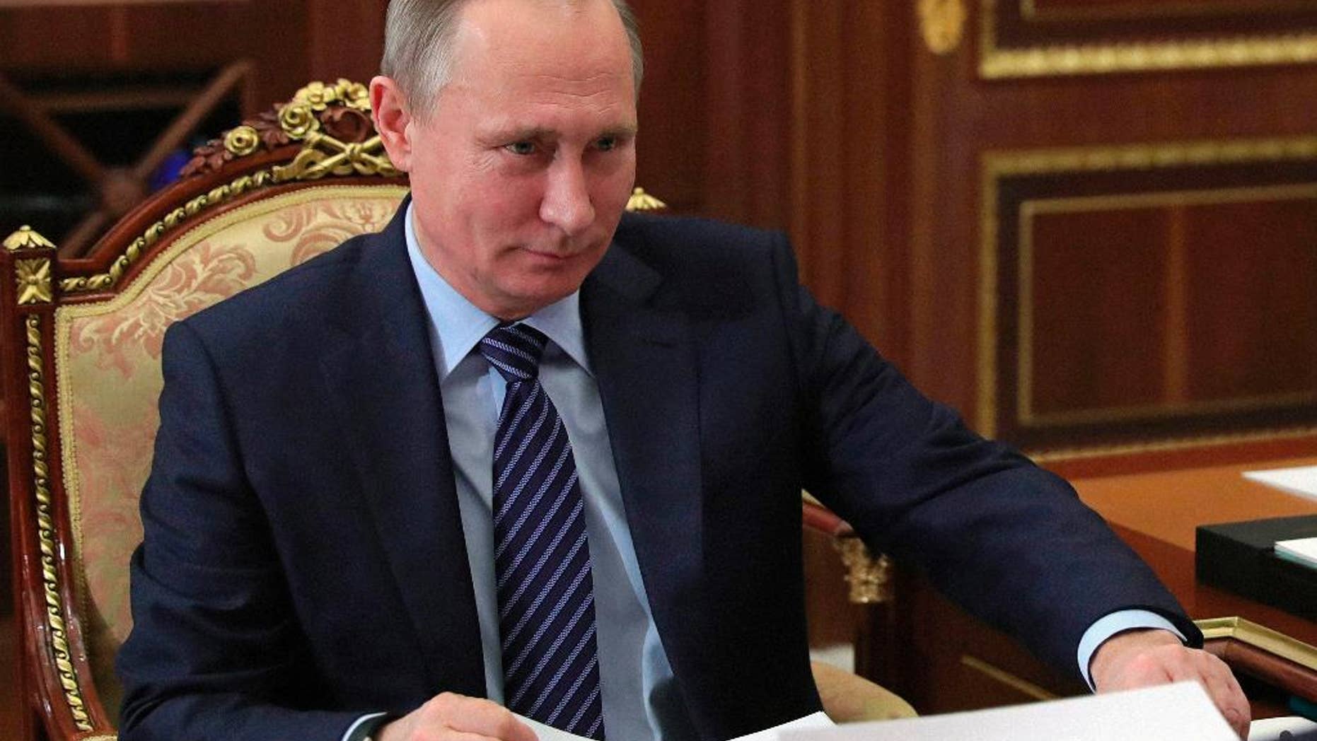 Russian President Vladimir Putin meets with Tver region governor Igor Rudenya in the Kremlin in Moscow, Russia, Monday, Dec. 12, 2016. (Mikhail Klimentyev/Sputnik, Kremlin Pool Photo via AP)