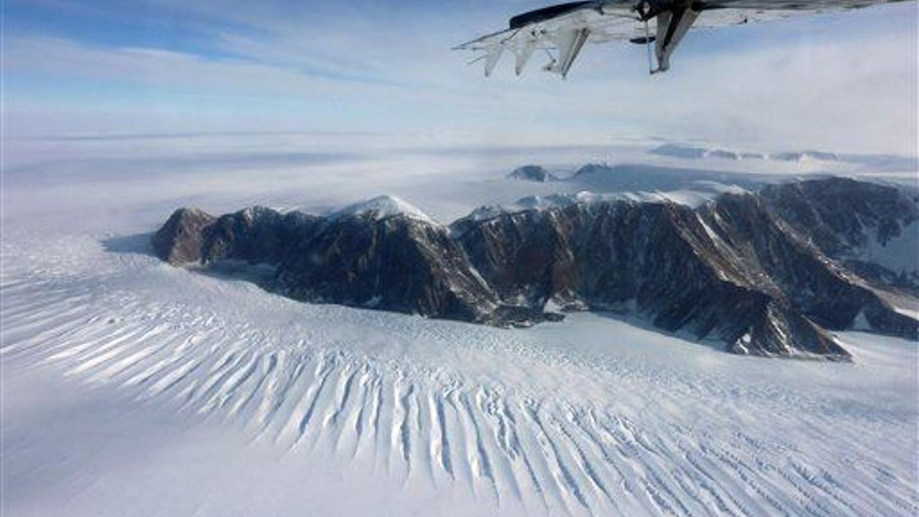 In this photo taken on Nov. 25, 2011, a plane flies over the Transantarctic Mountains.
