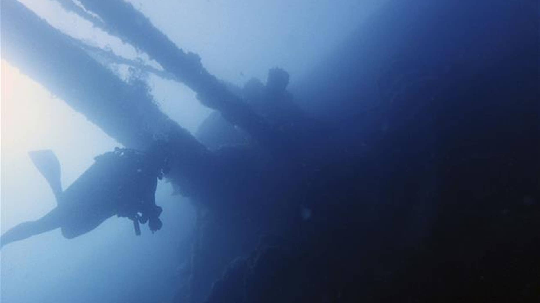 A diver swims under part of the Italian World War II shipwreck MV Probitas in a bay near Saranda, Albania.