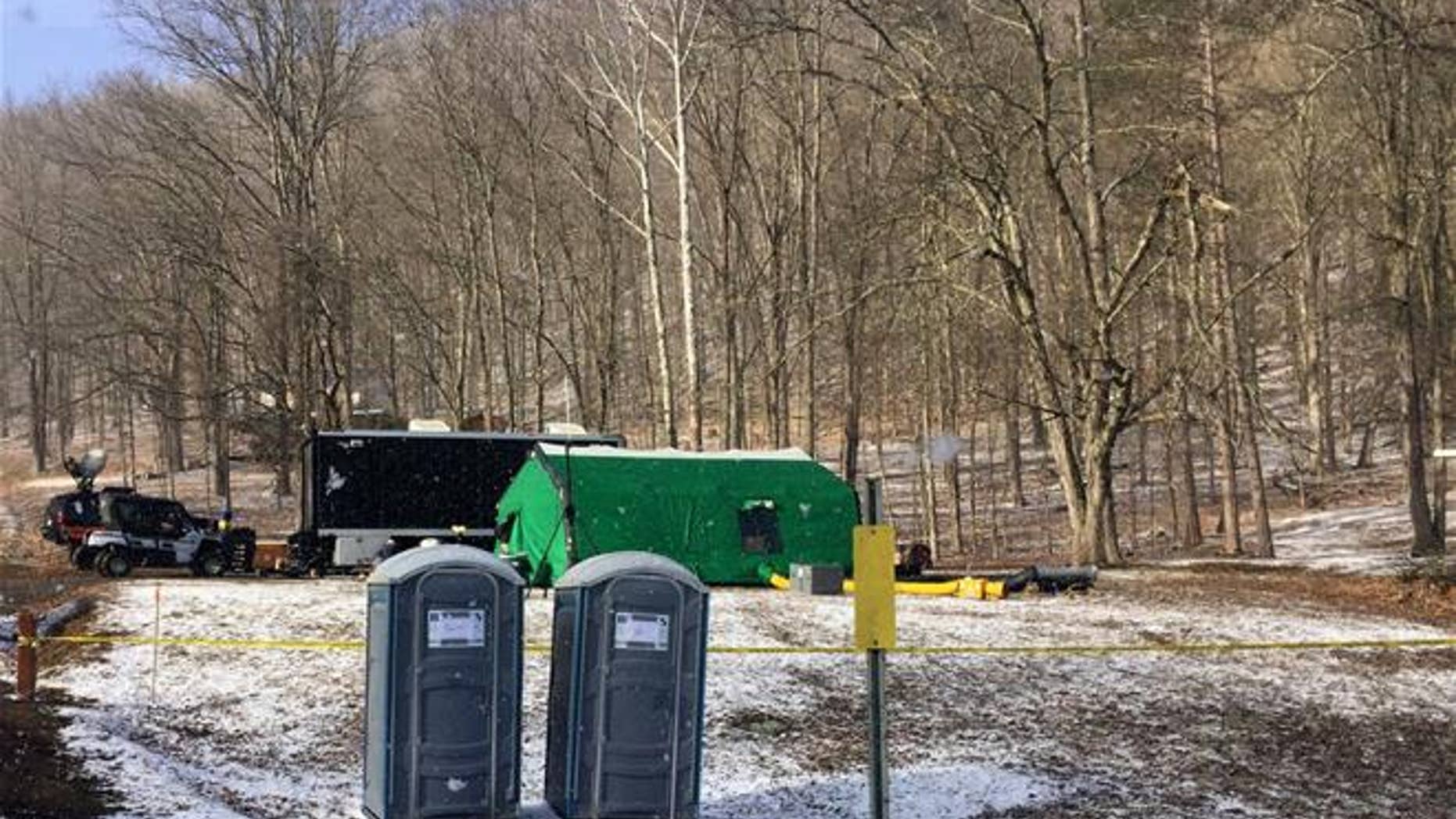 FBI agents and representatives of the Pennsylvania Department of Conservation and Natural Resources set up a base off Route 555 in Benezette Township, Elk County, Pa., at a site where treasure hunters say Civil War-era gold is buried.